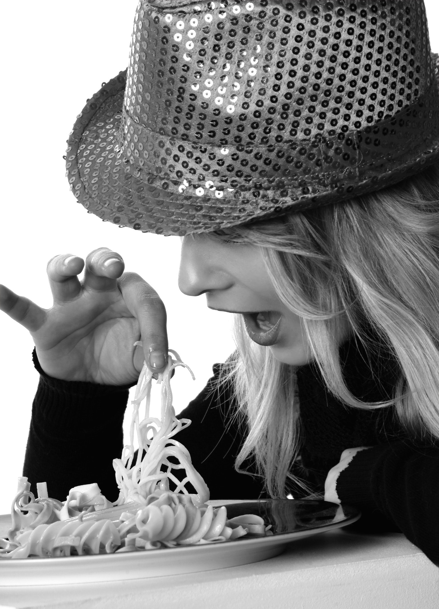 Woman in Sweater and Sequin Fedora Hat Holding Noodles in Grayscale Photography, Bite, Manners, Pretty, Pasta, HQ Photo