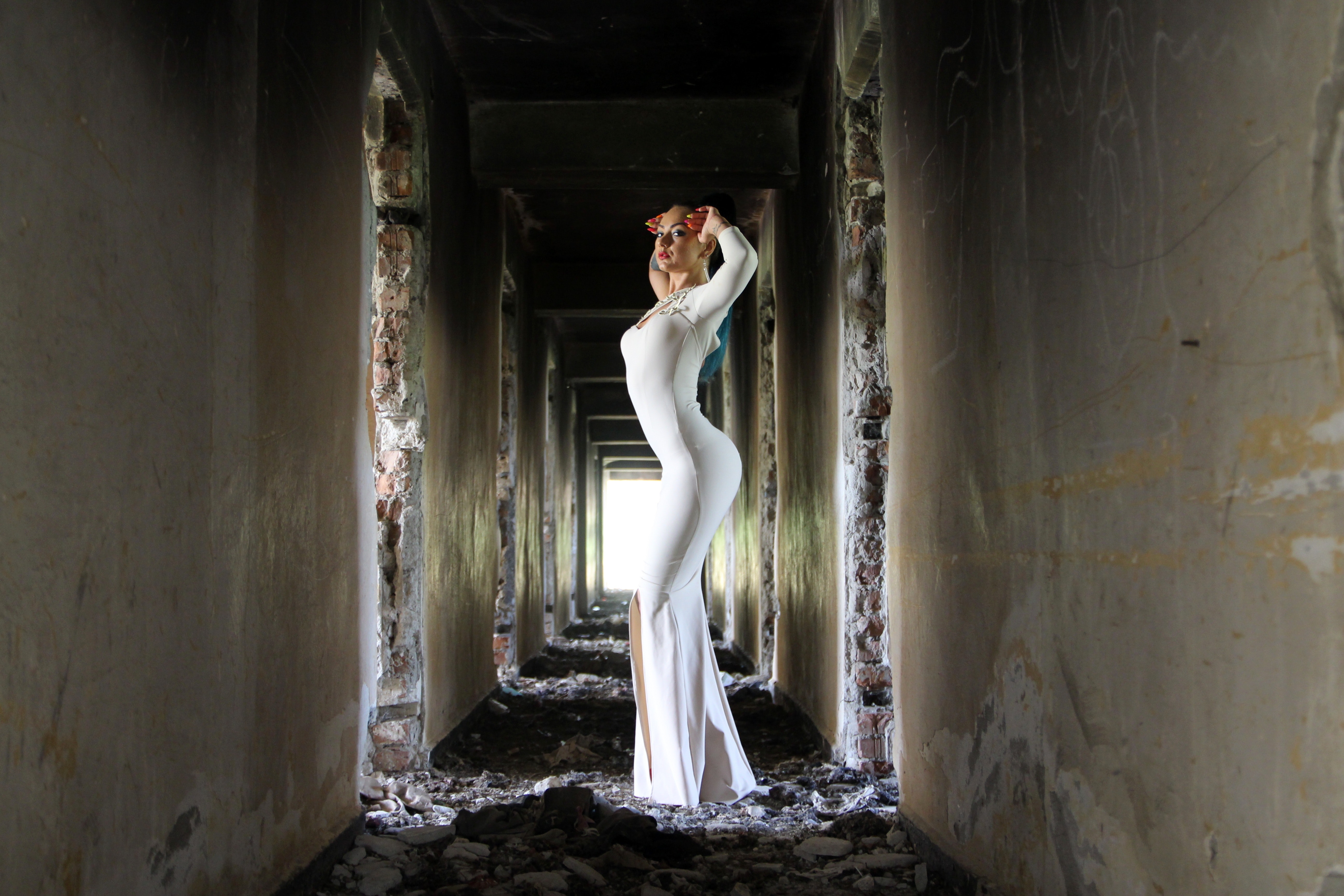 Woman in White Bodycon Maxi Dress Posting in Between White Concrete Wall, Abandoned, Beautiful, Dress, Eerie, HQ Photo