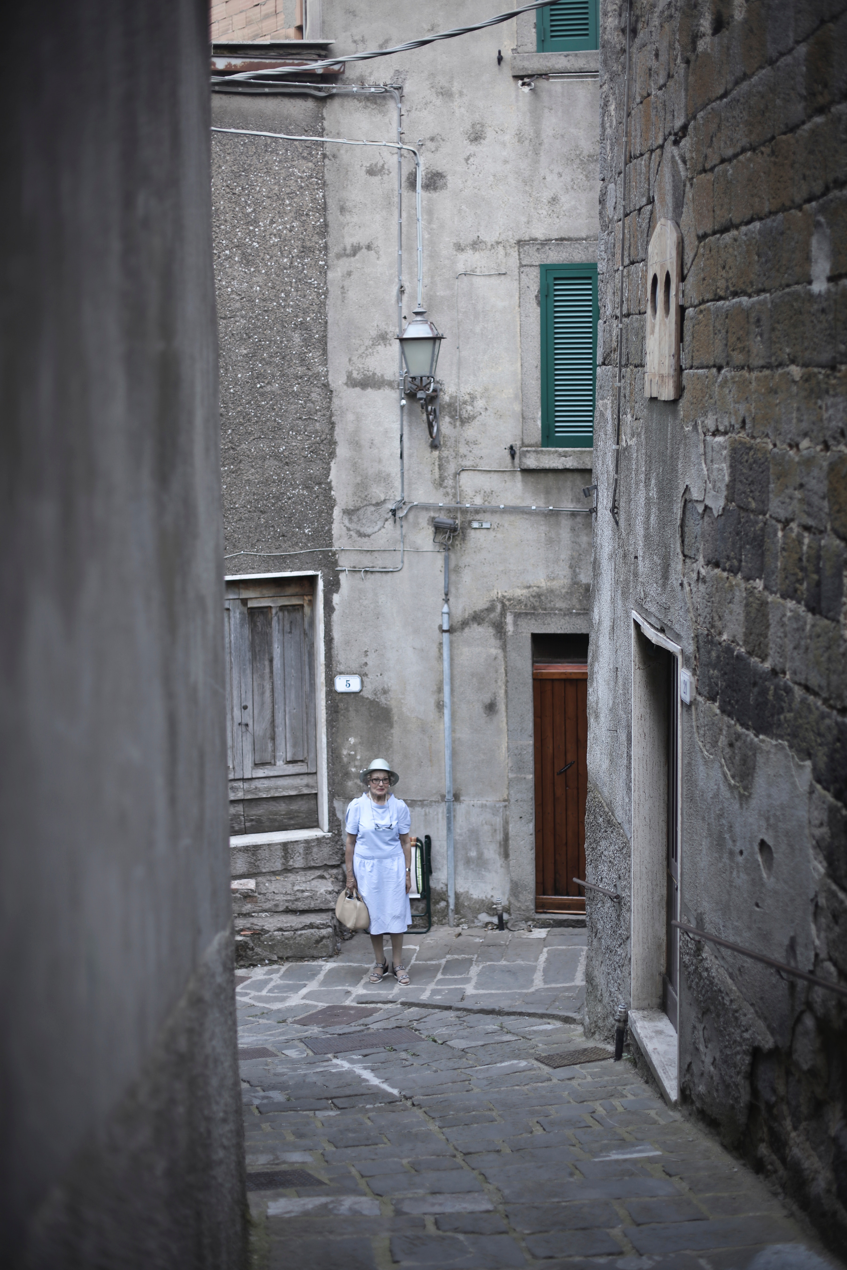 Woman in white dress walking photo