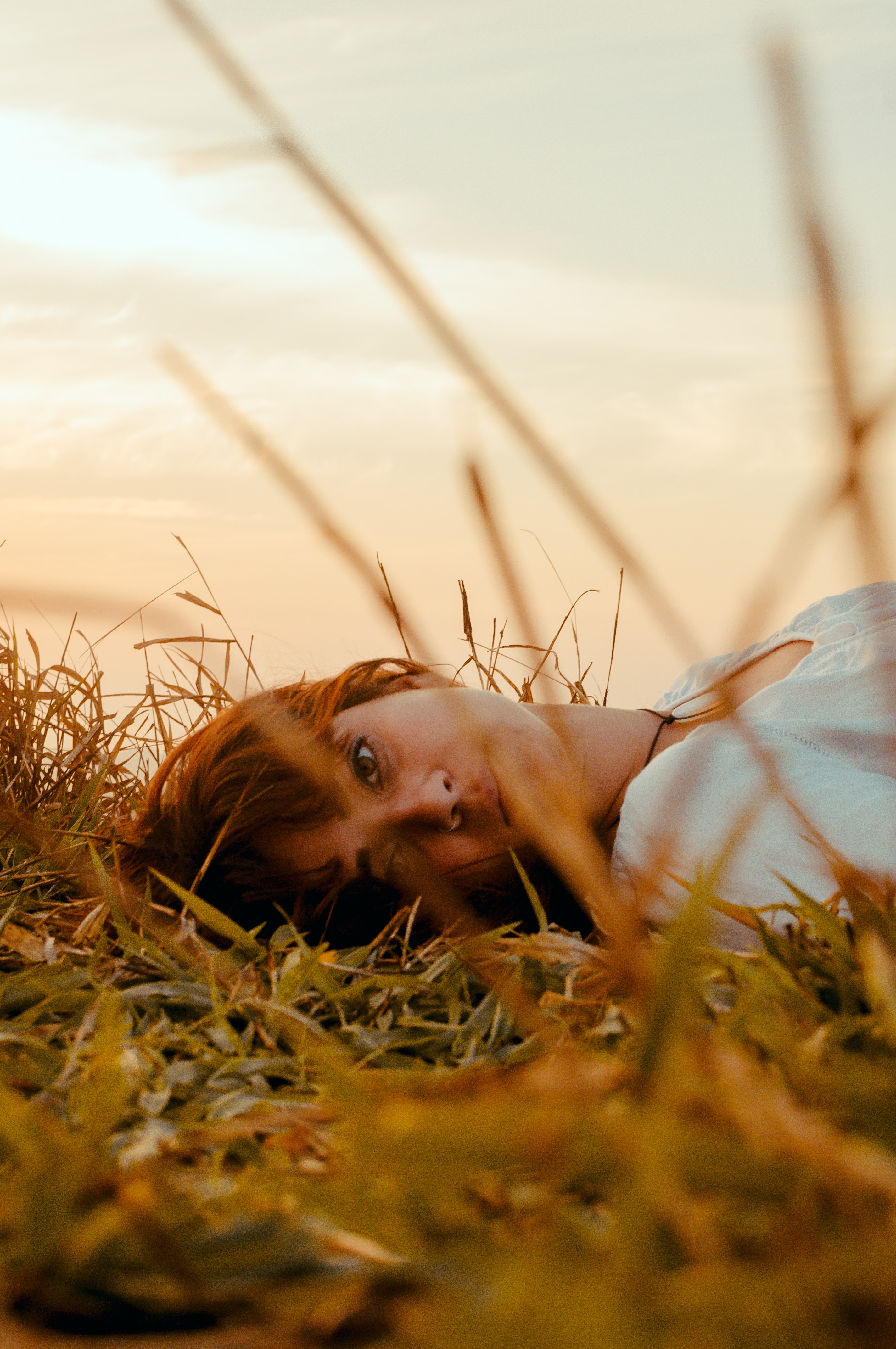 Woman laying on the grass photo