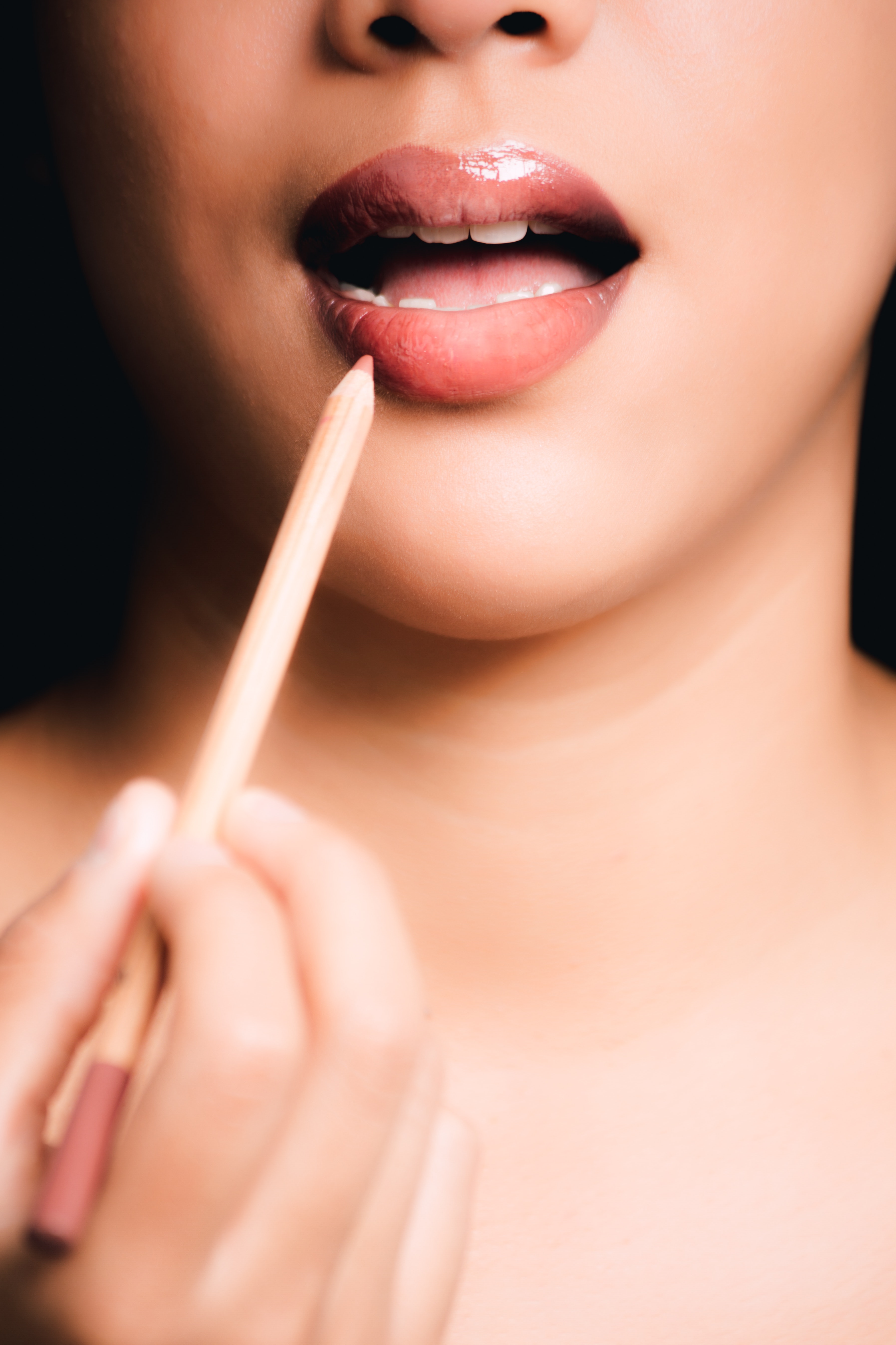 Woman lipstick pencil photo