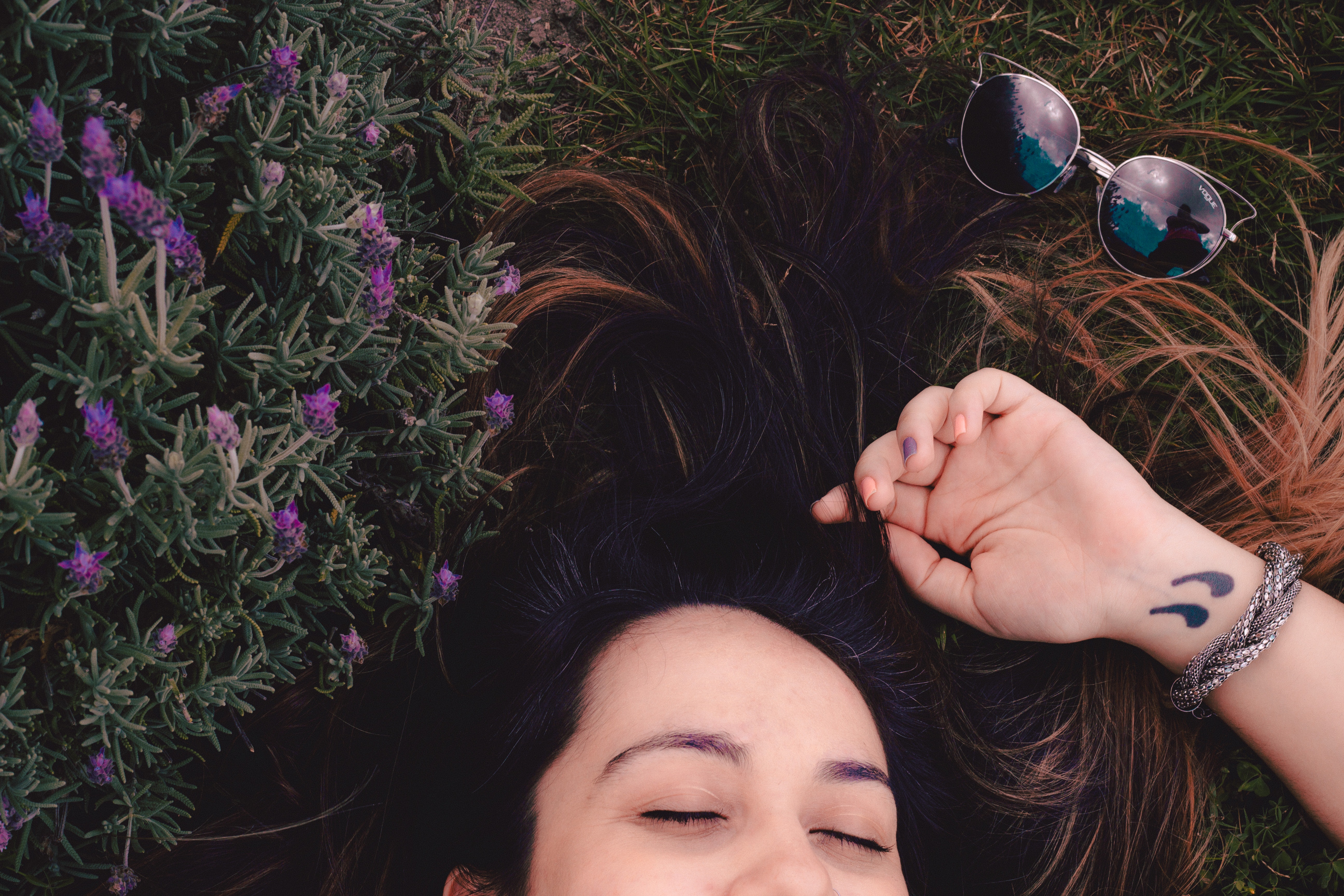 Woman lying on flower field photo