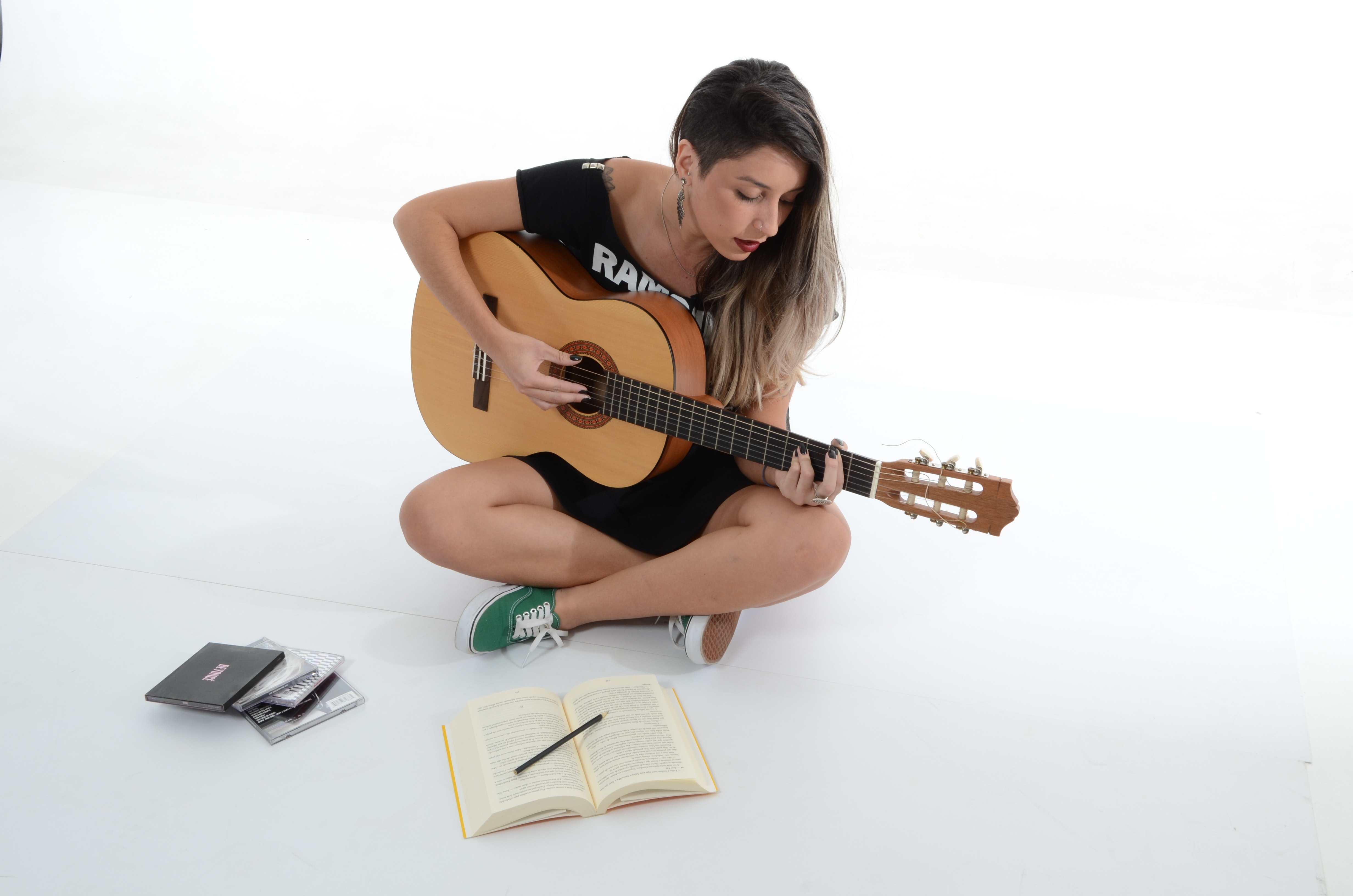 Woman playing brown classical guitar photo