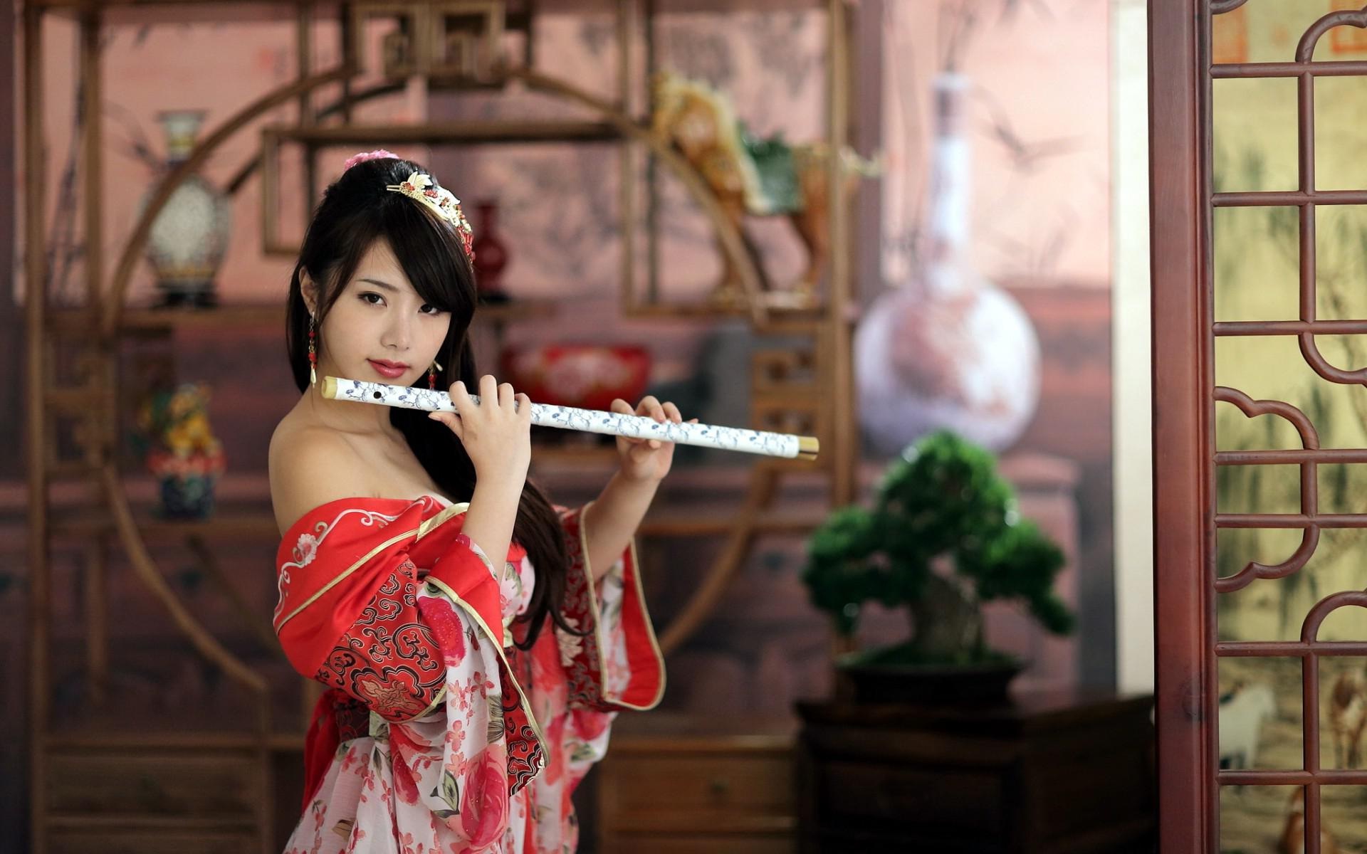Woman playing flute photo