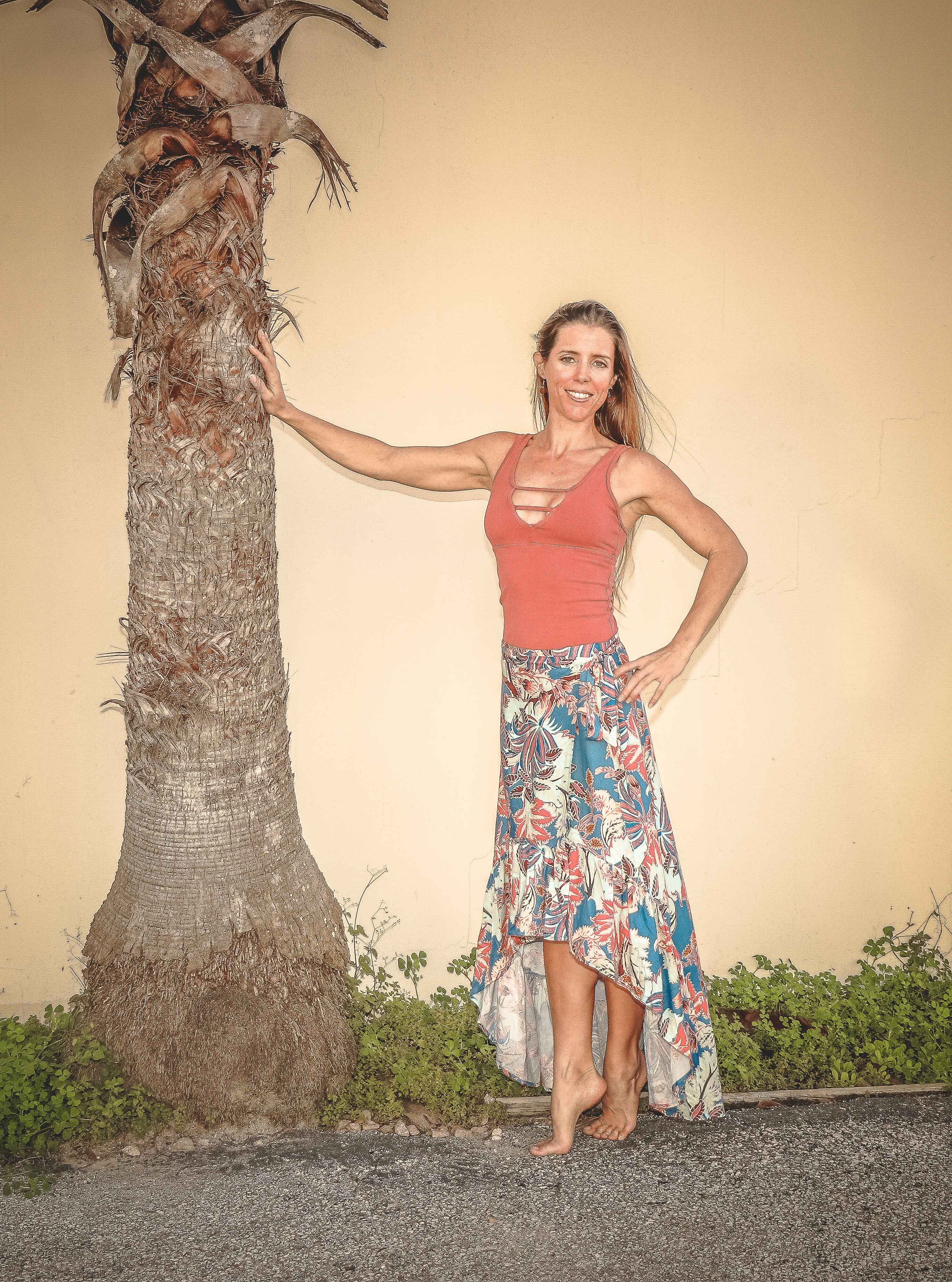 Woman posing near tree photo