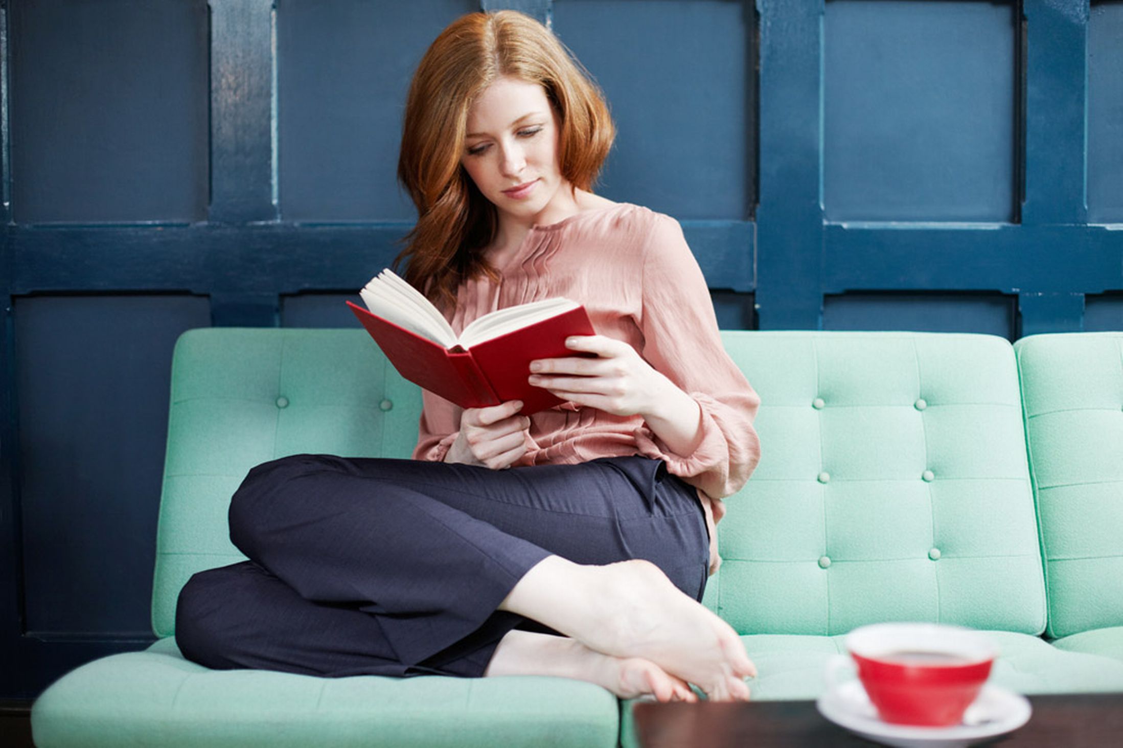 Woman-reading-a-book-on-sofa - Swellby Blog