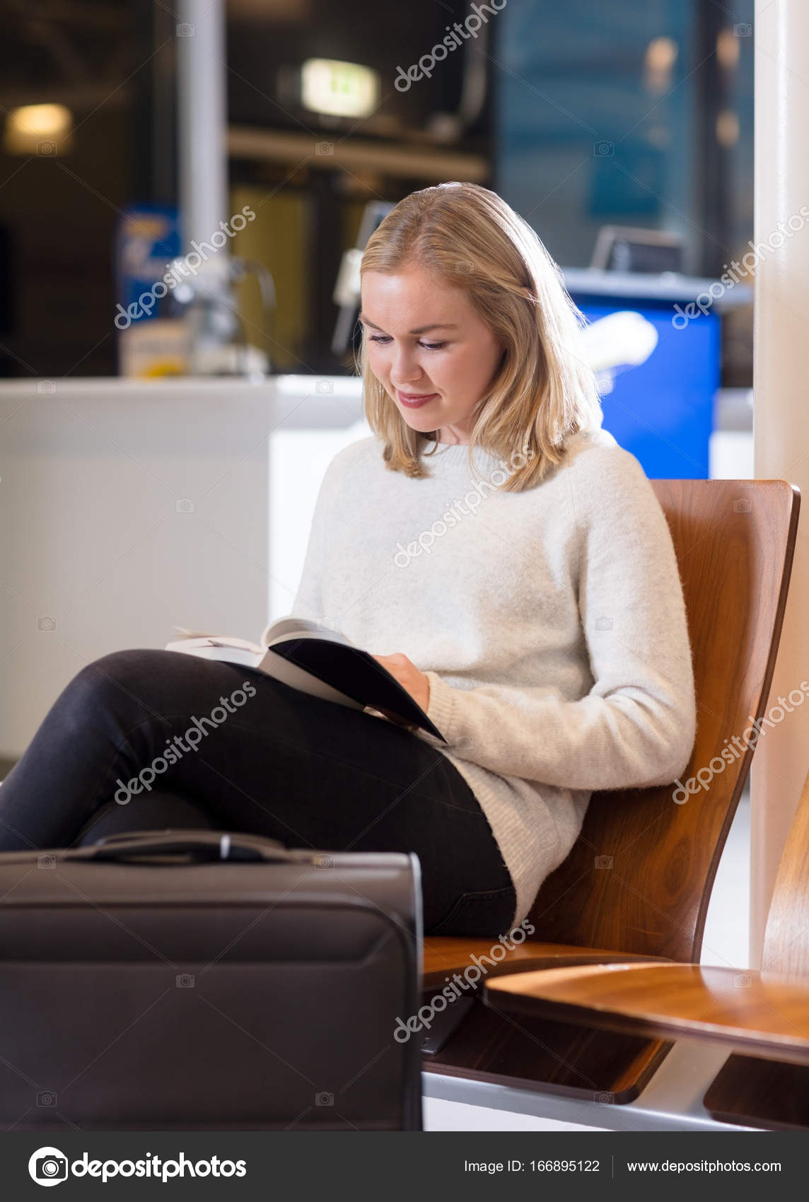 Woman Reading Book In Airport Waiting Area — Stock Photo ...