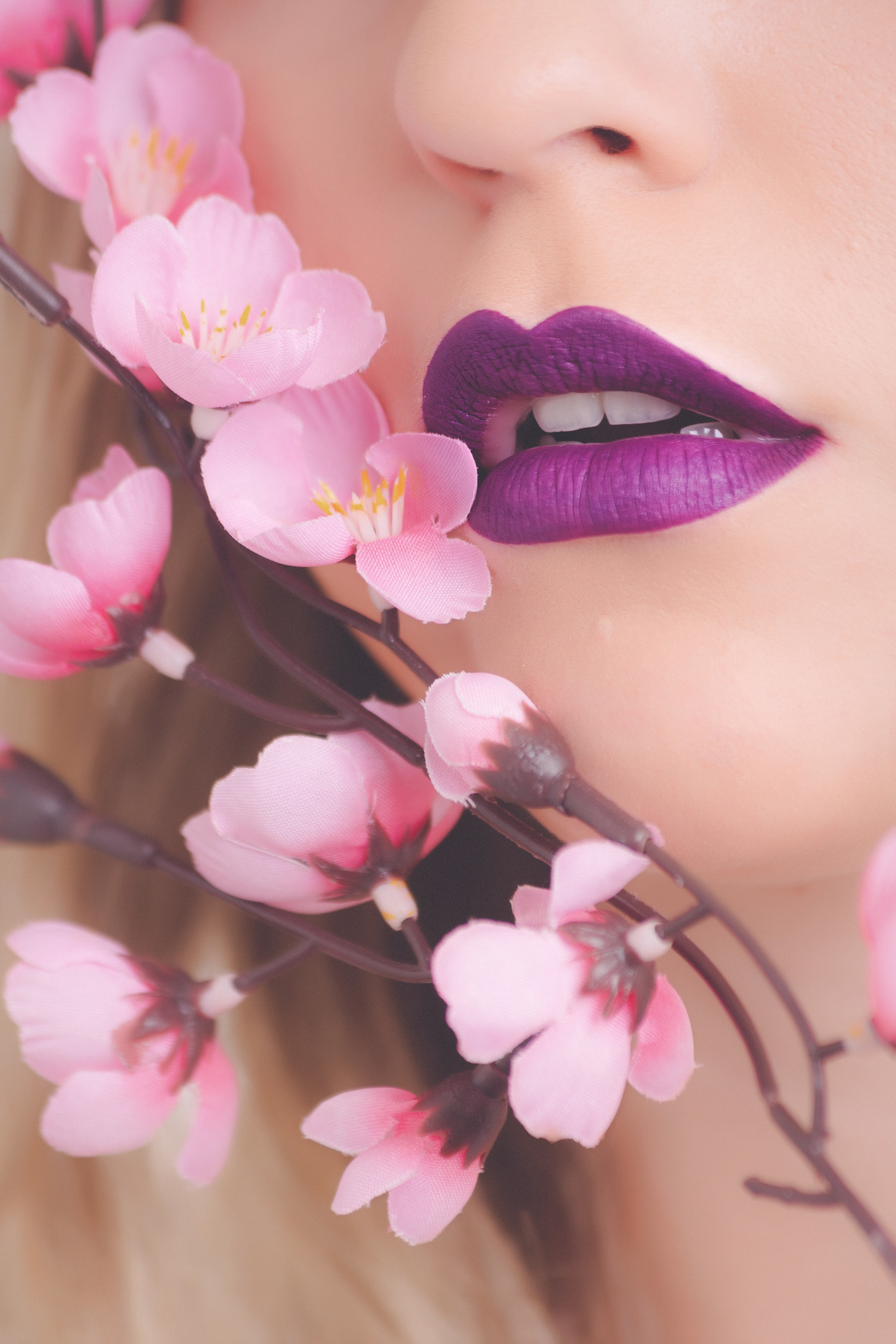 Woman showing her purple lipstick photo