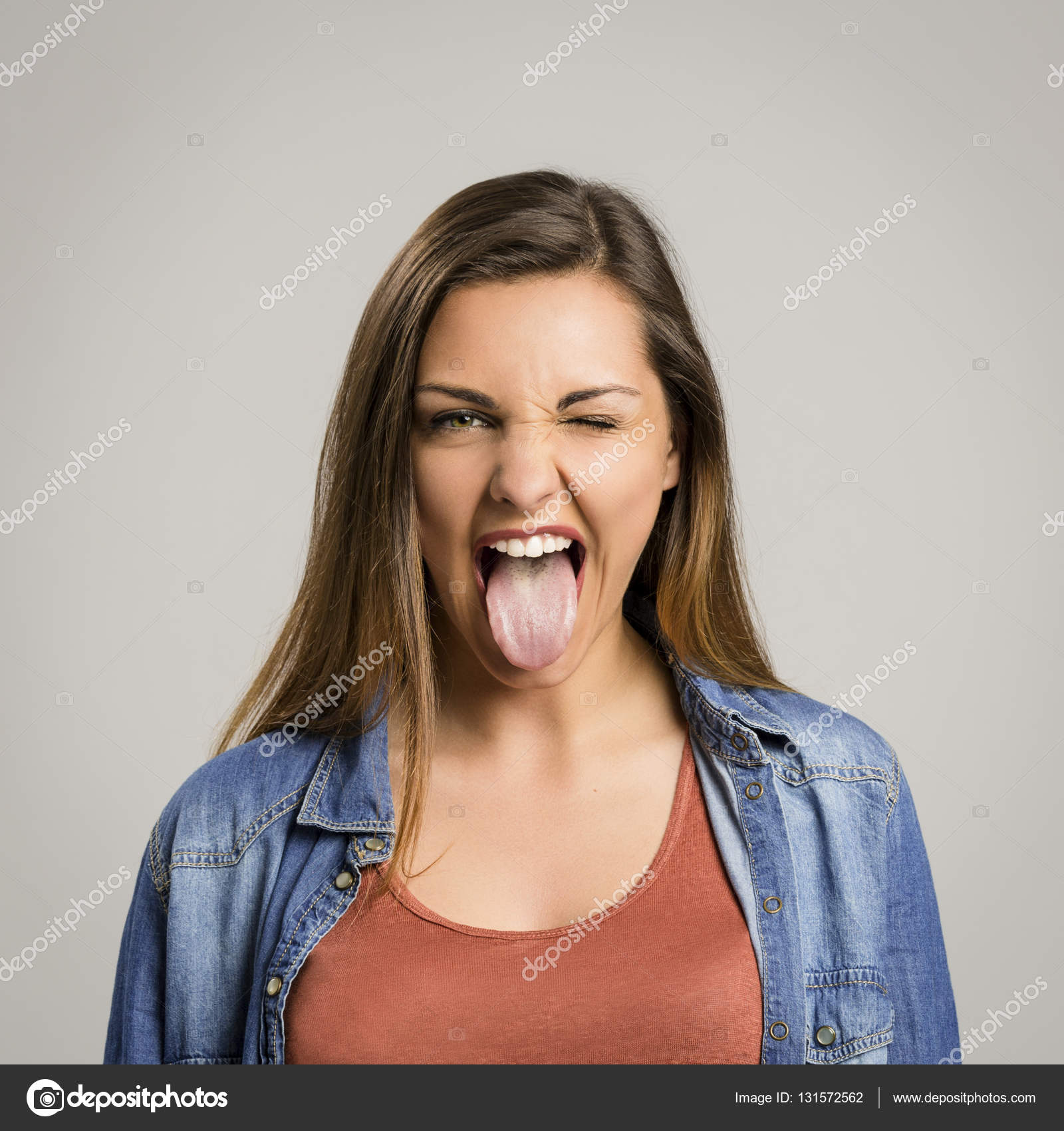 Woman showing tongue out — Stock Photo © ikostudio #131572562