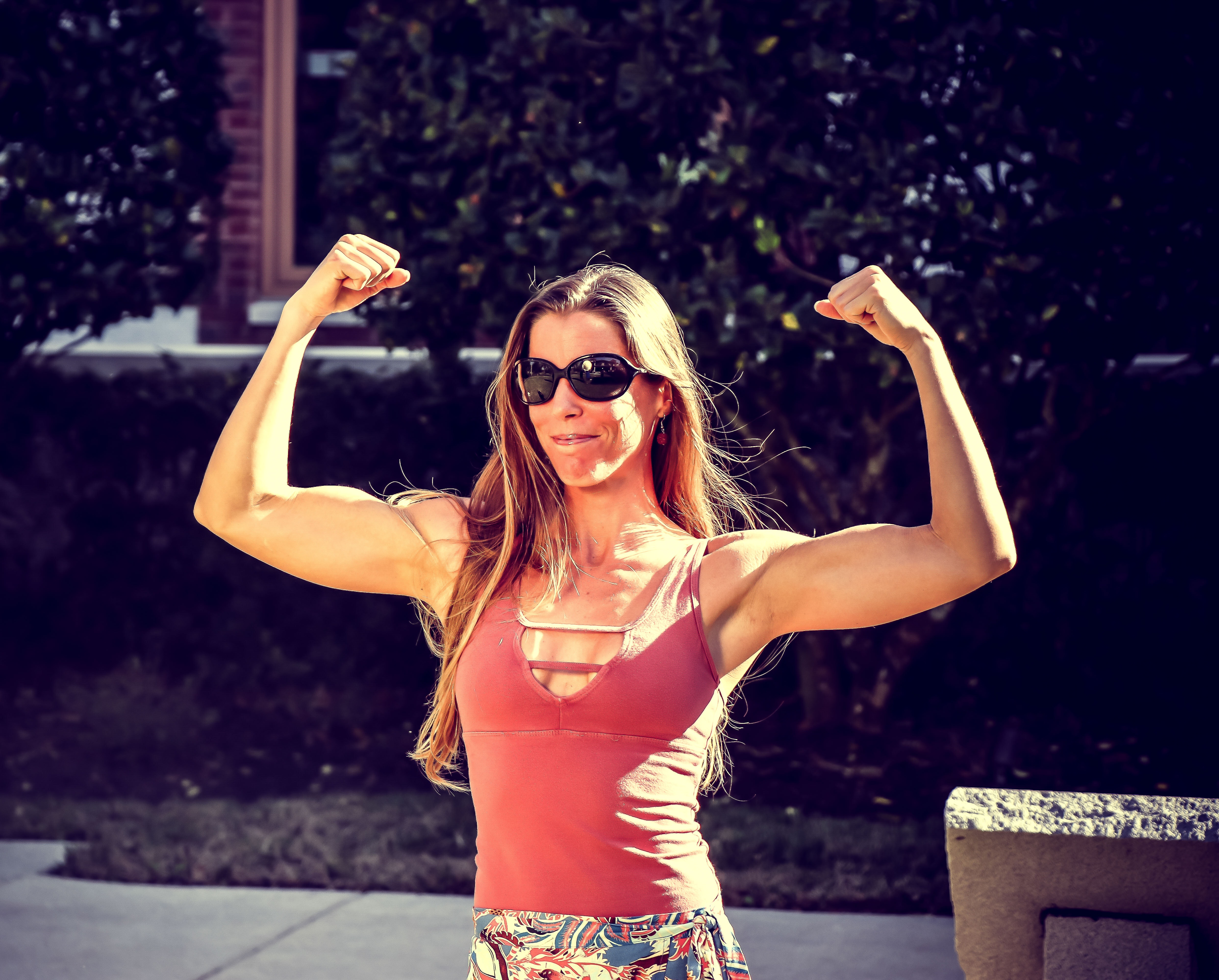Woman showing muscles photo