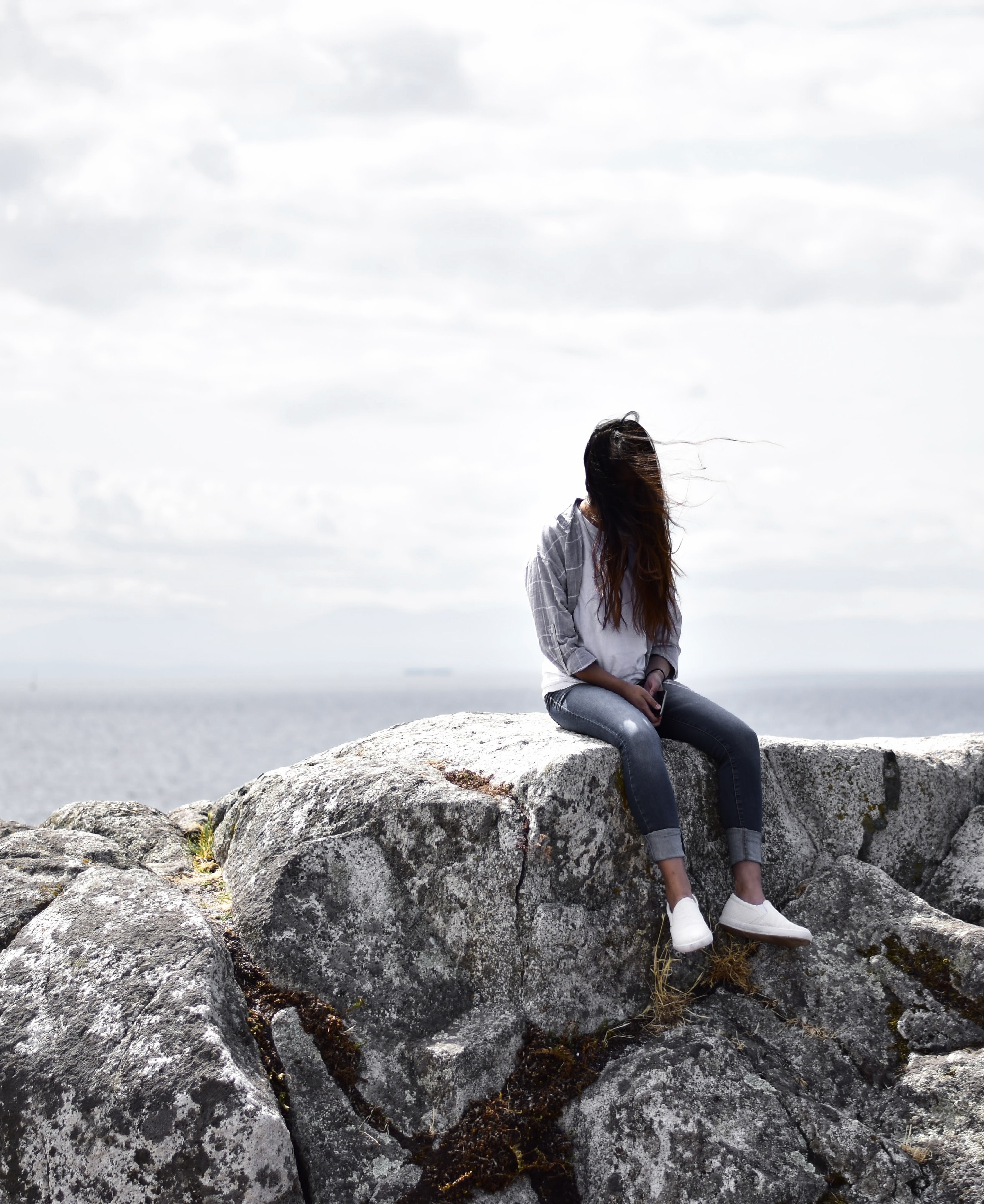 Woman Sits on Gray Rock, Beach, Clouds, Daytime, Landscape, HQ Photo
