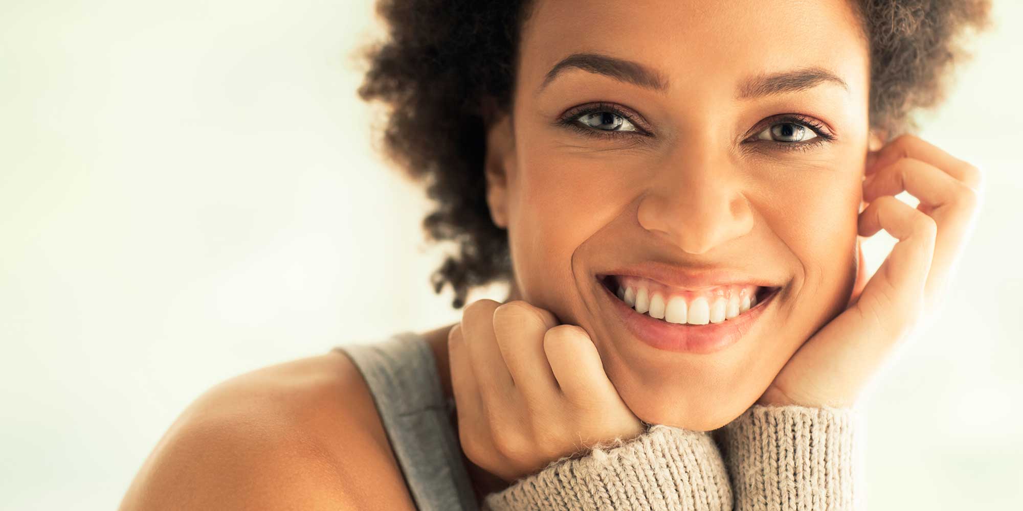 Wellness Programs - African American Woman Smiling - Health Blossoms