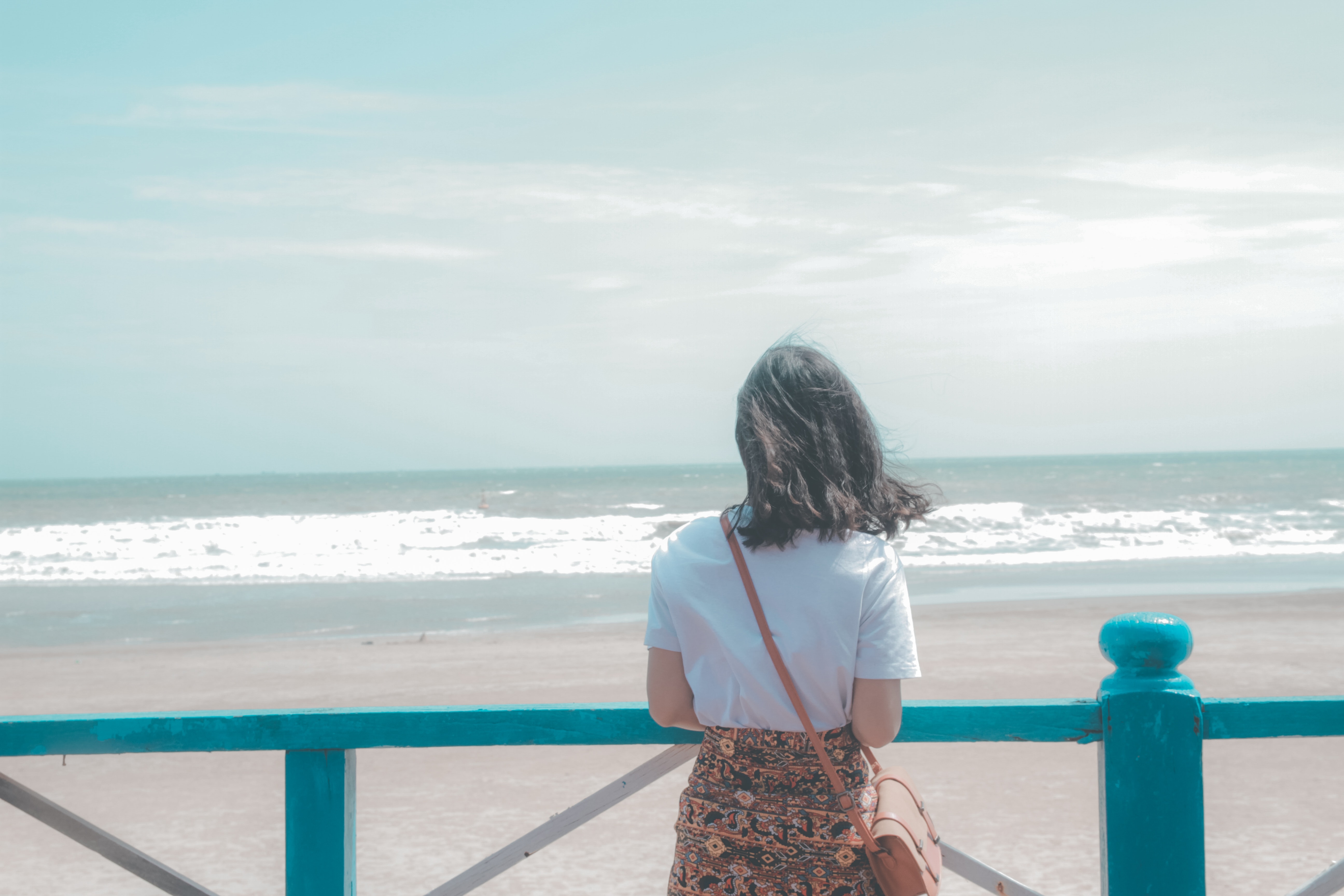 Woman standing near seashore photo