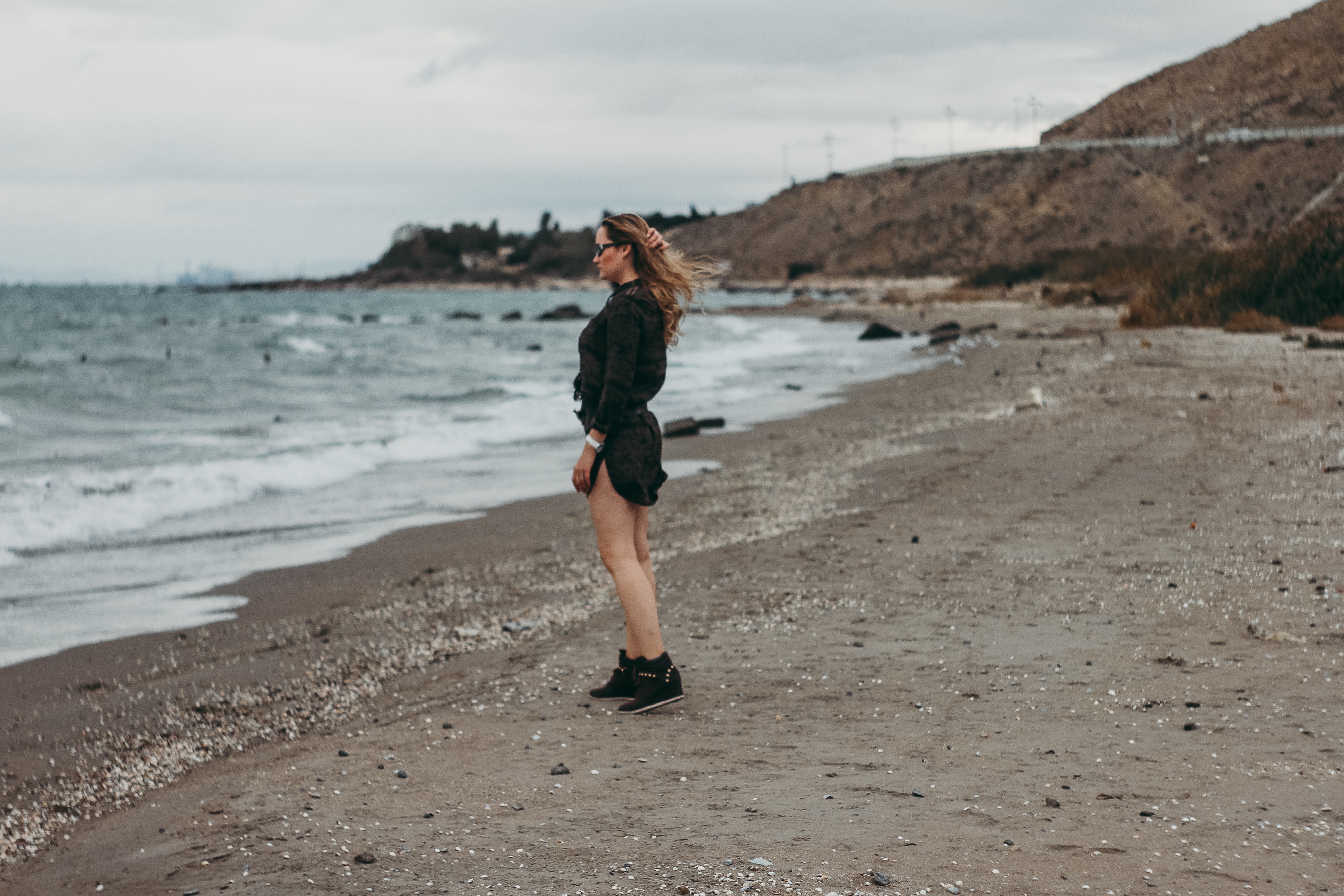 Woman standing on seashore photo