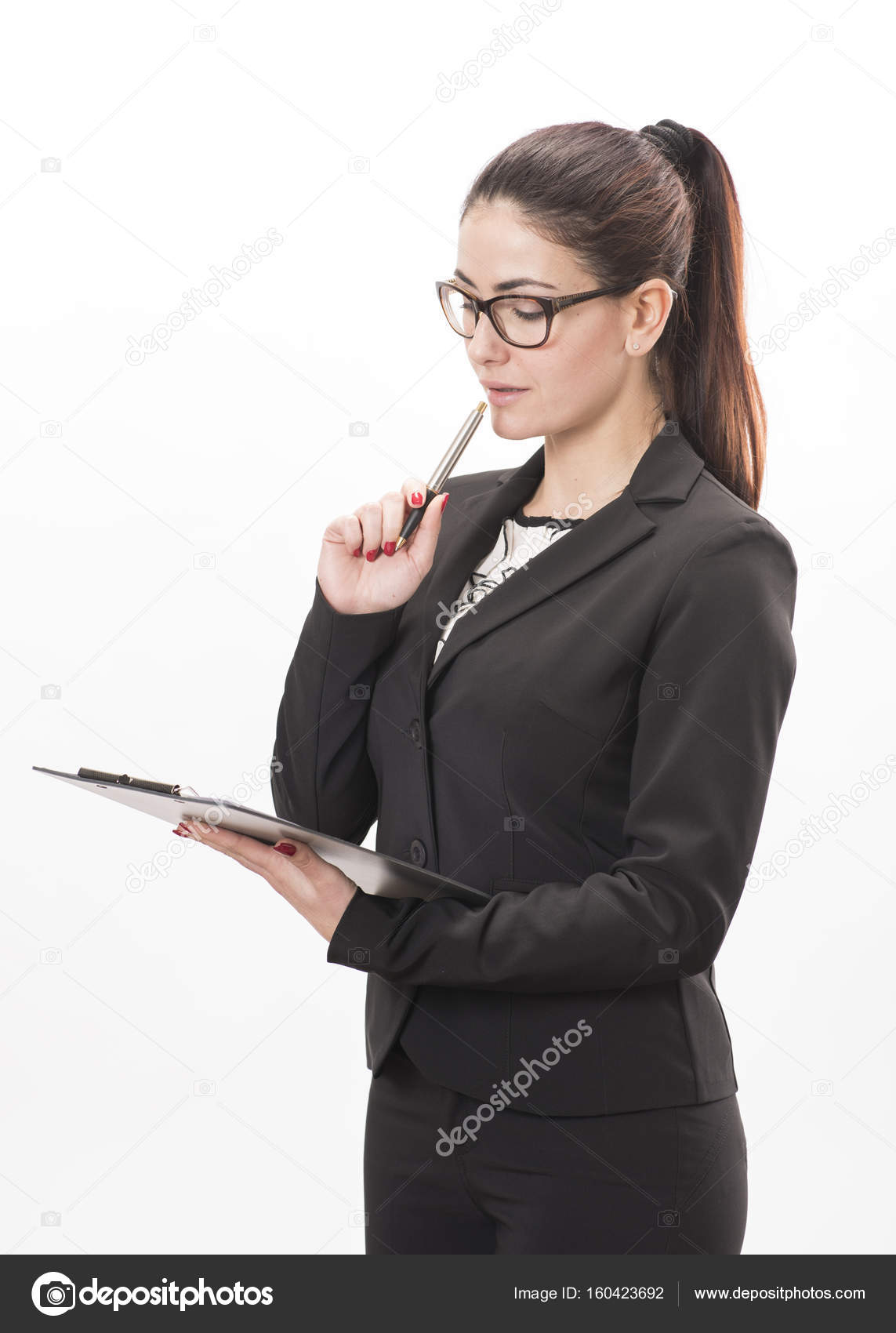 Beautiful business woman taking notes on her clipboard — Stock Photo ...