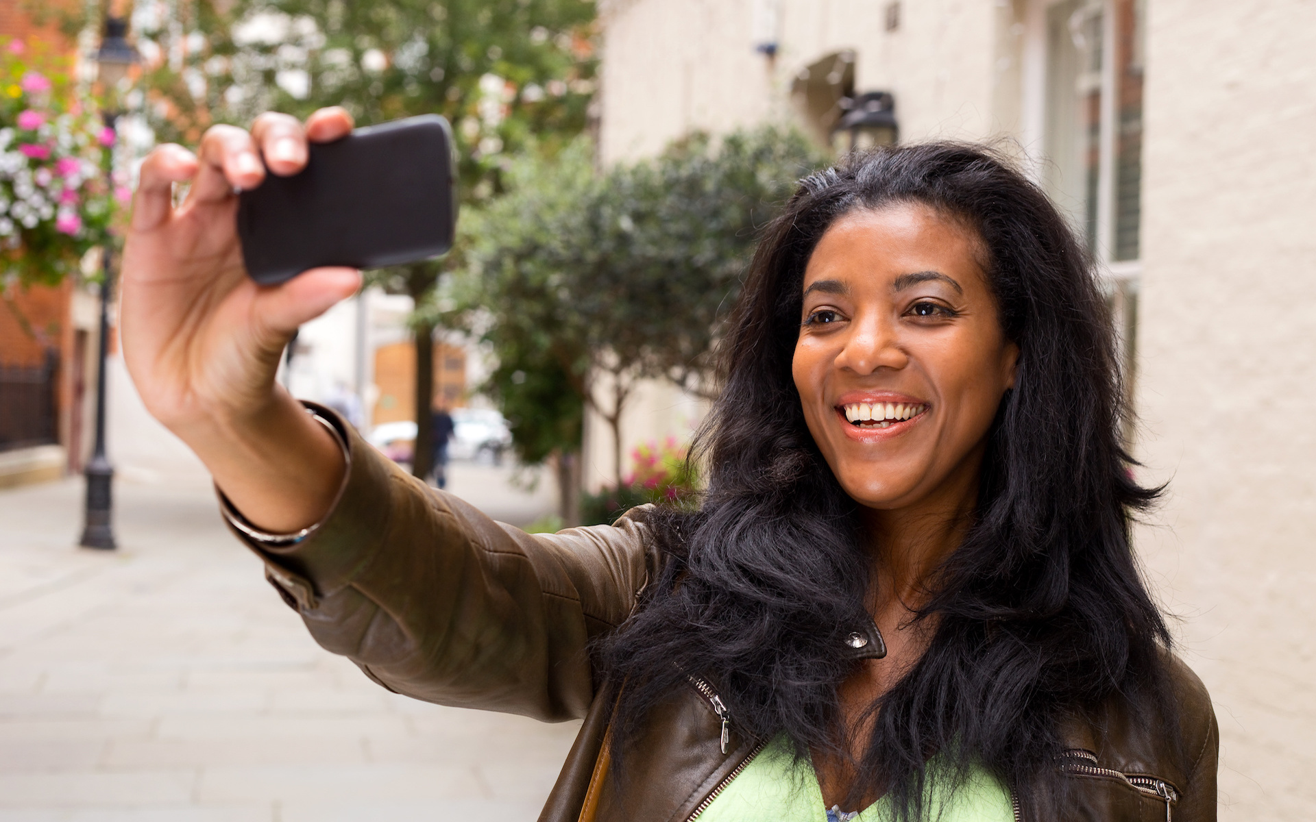 african american woman taking a selfie – Harvest Life Changers Church