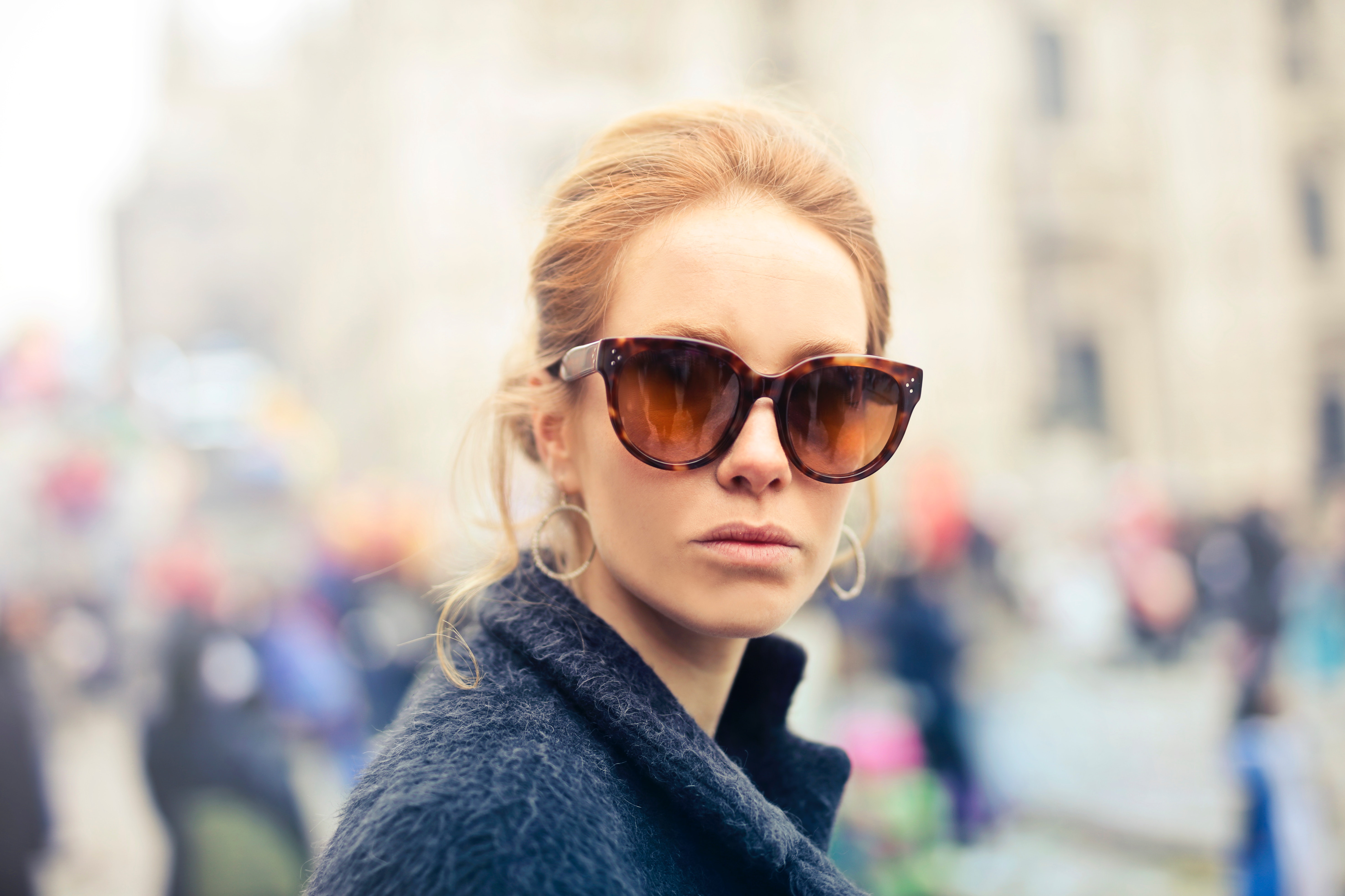 Woman wearing black-framed sunglasses photo