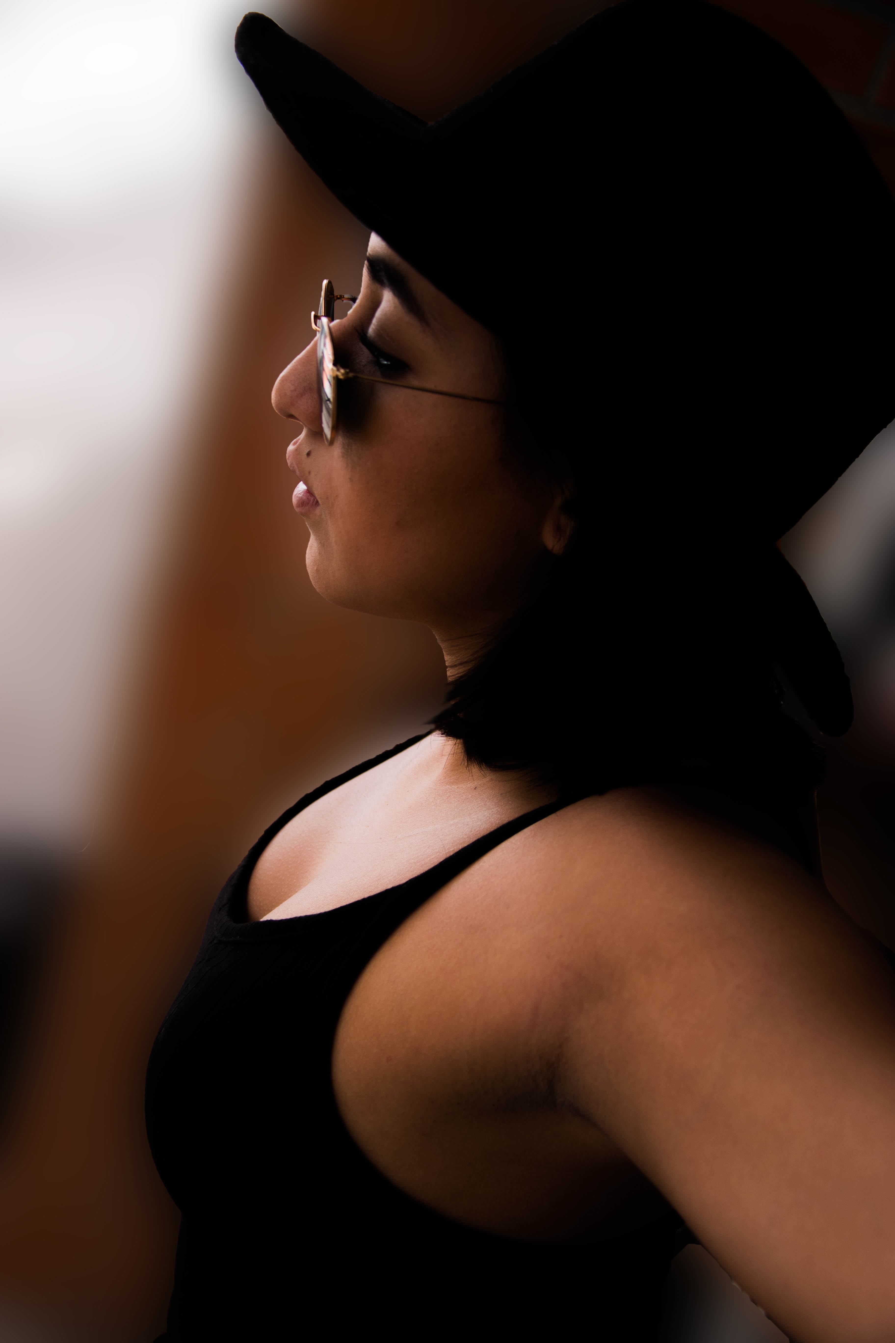 Woman wearing black tank top and sunglasses photo