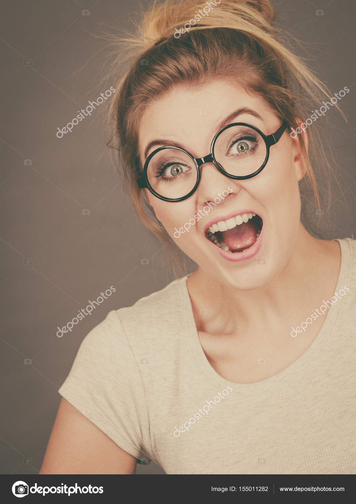 Happy teenage woman wearing eyeglasses — Stock Photo © Voyagerix ...