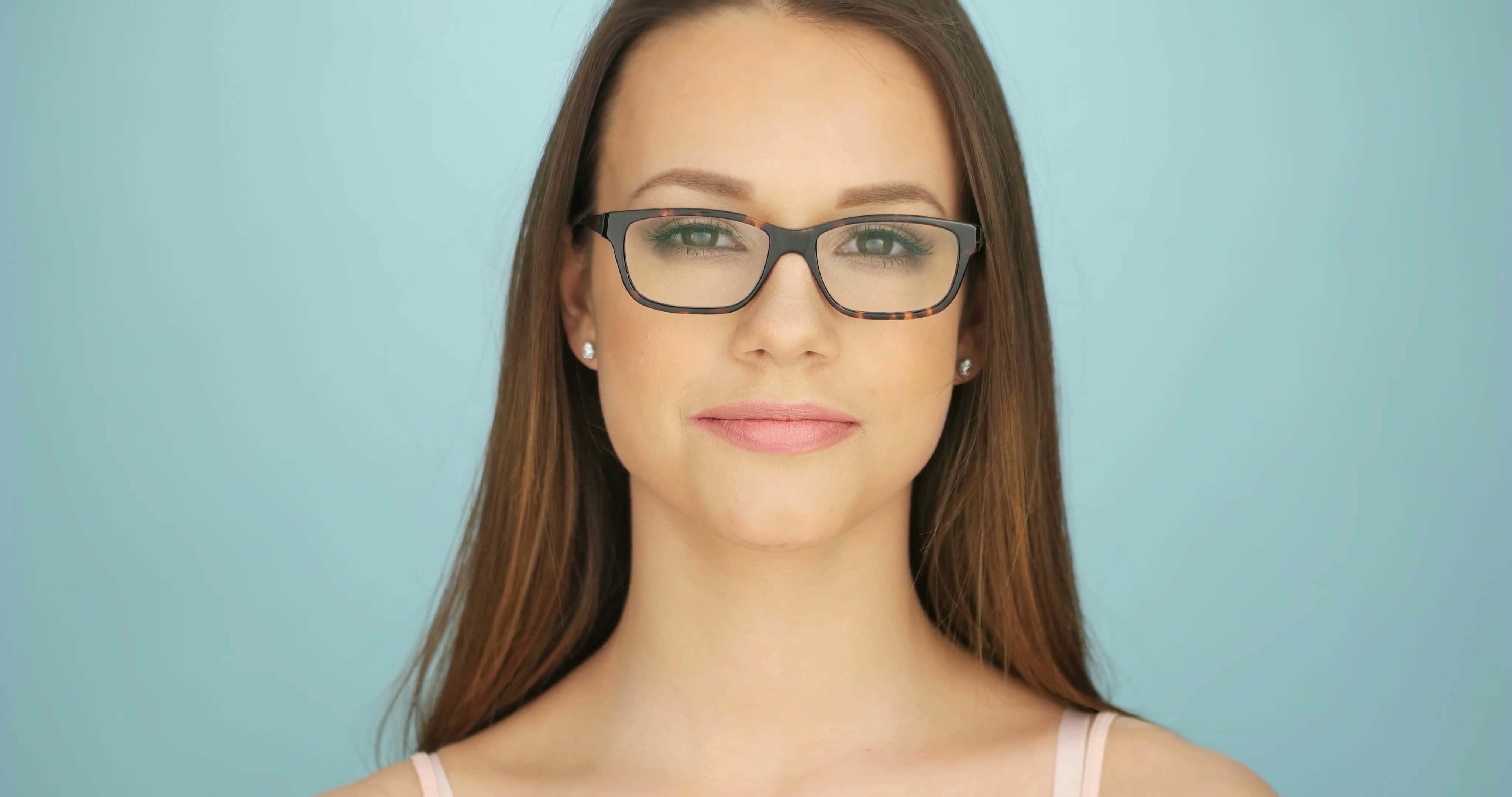 Serious attractive thoughtful young woman wearing glasses staring ...