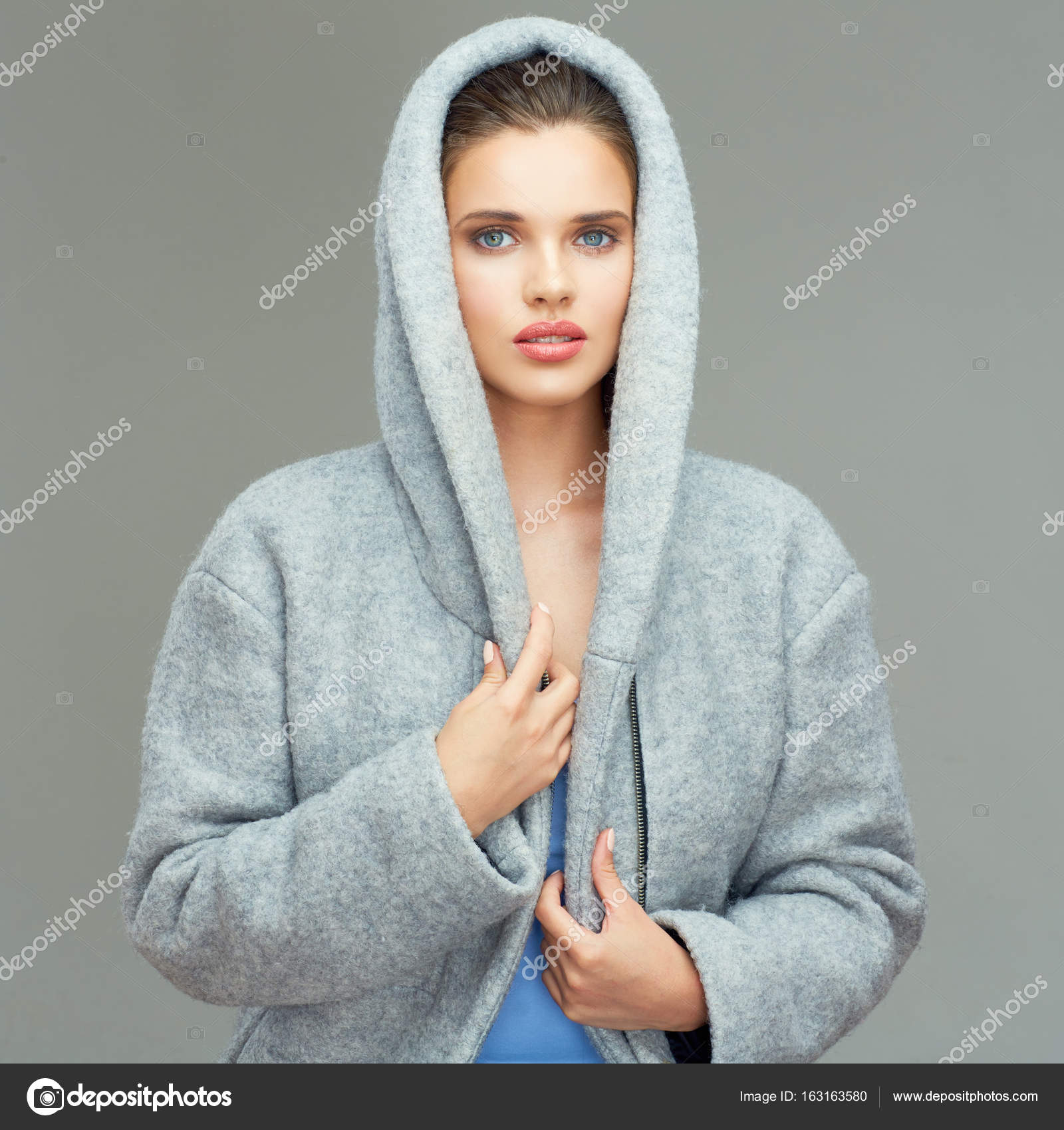 woman wearing gray coat with big hood — Stock Photo © sheftsoff ...