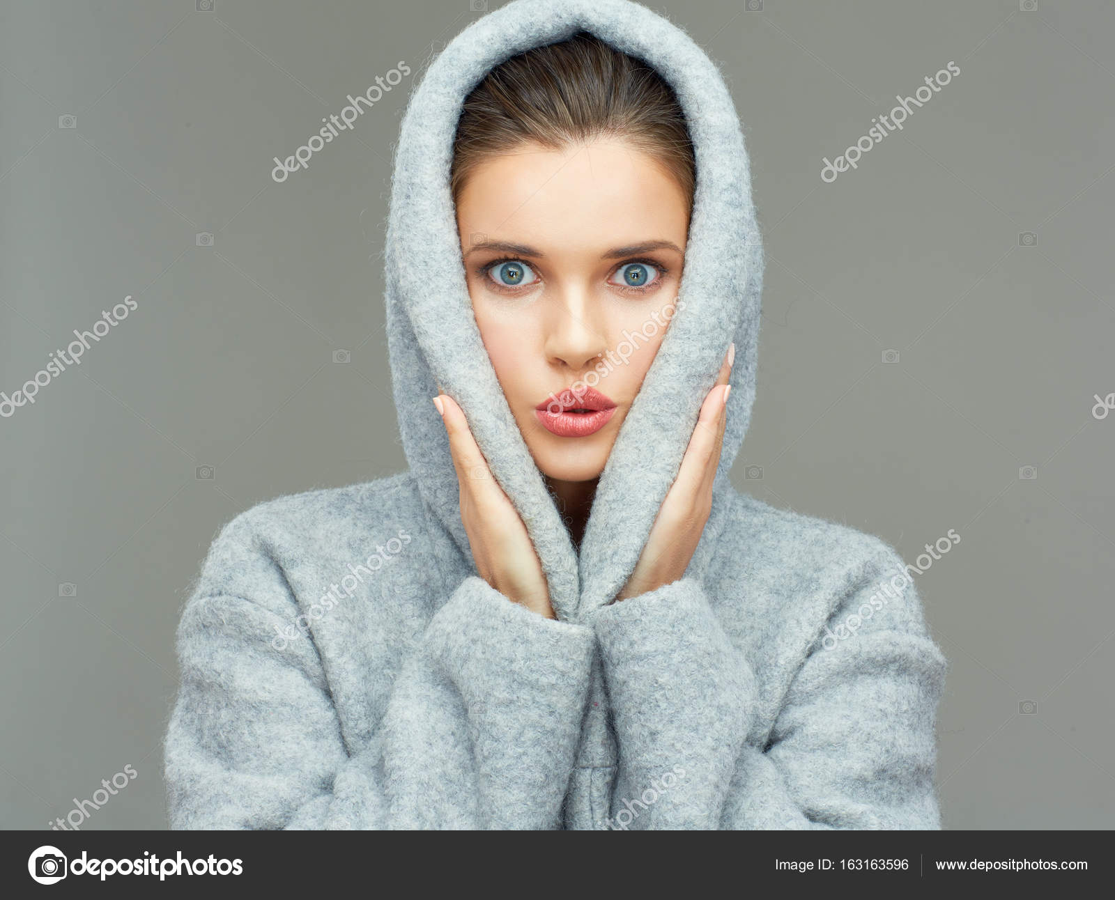 woman wearing gray coat with big hood — Stock Photo © sheftsoff ...