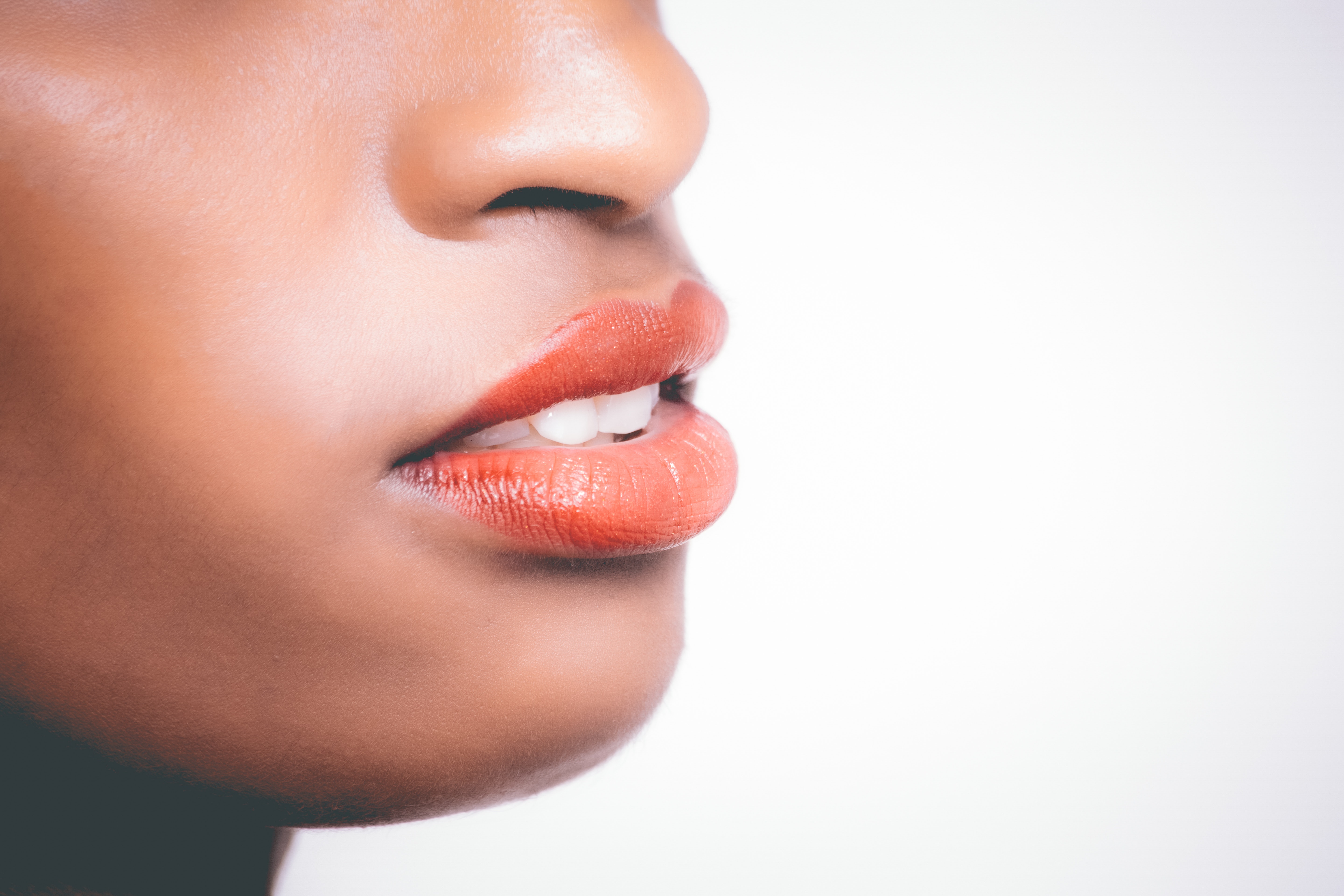 Woman wearing orange lipstick photo