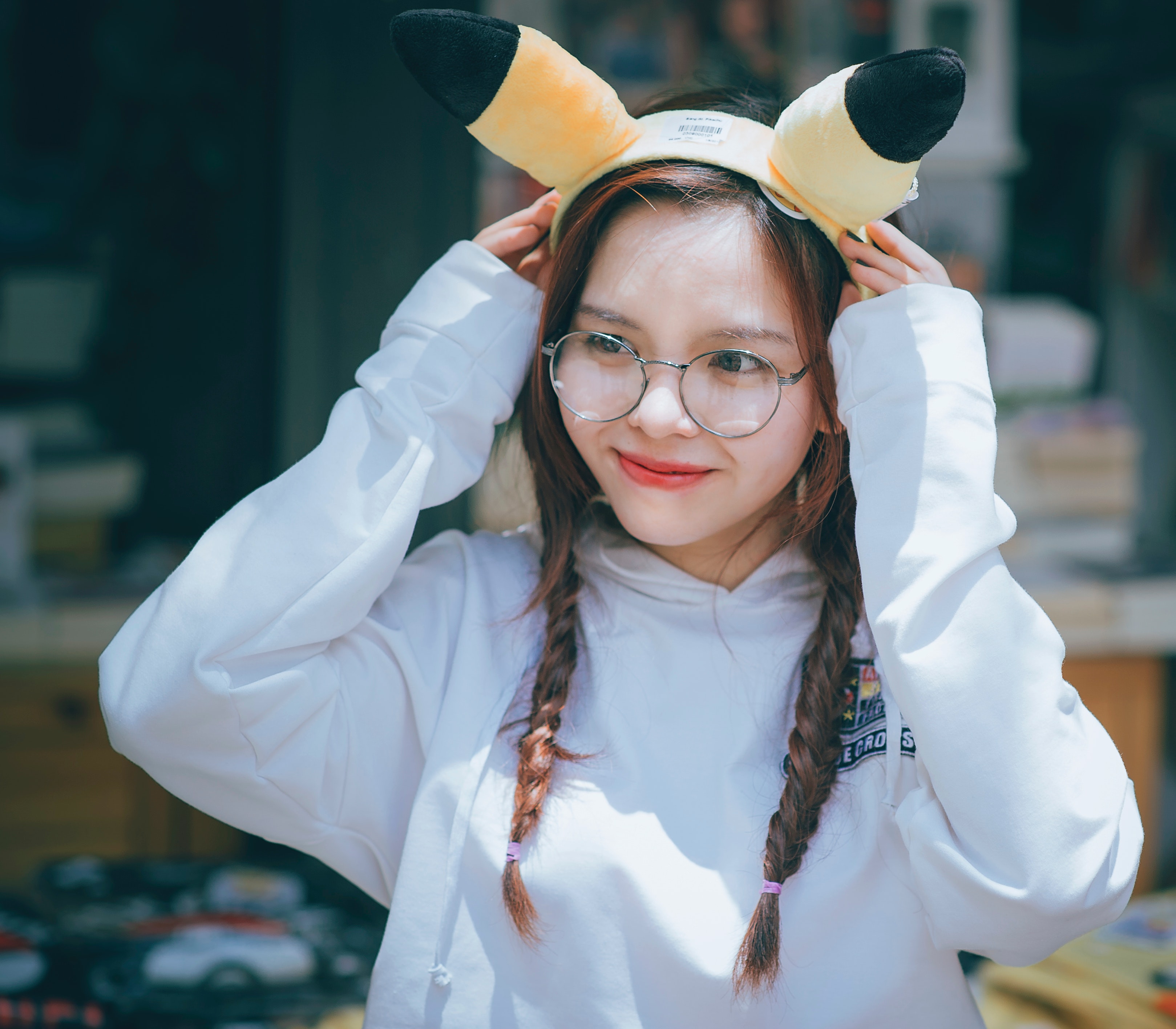 Woman wearing pikachu alice band photo
