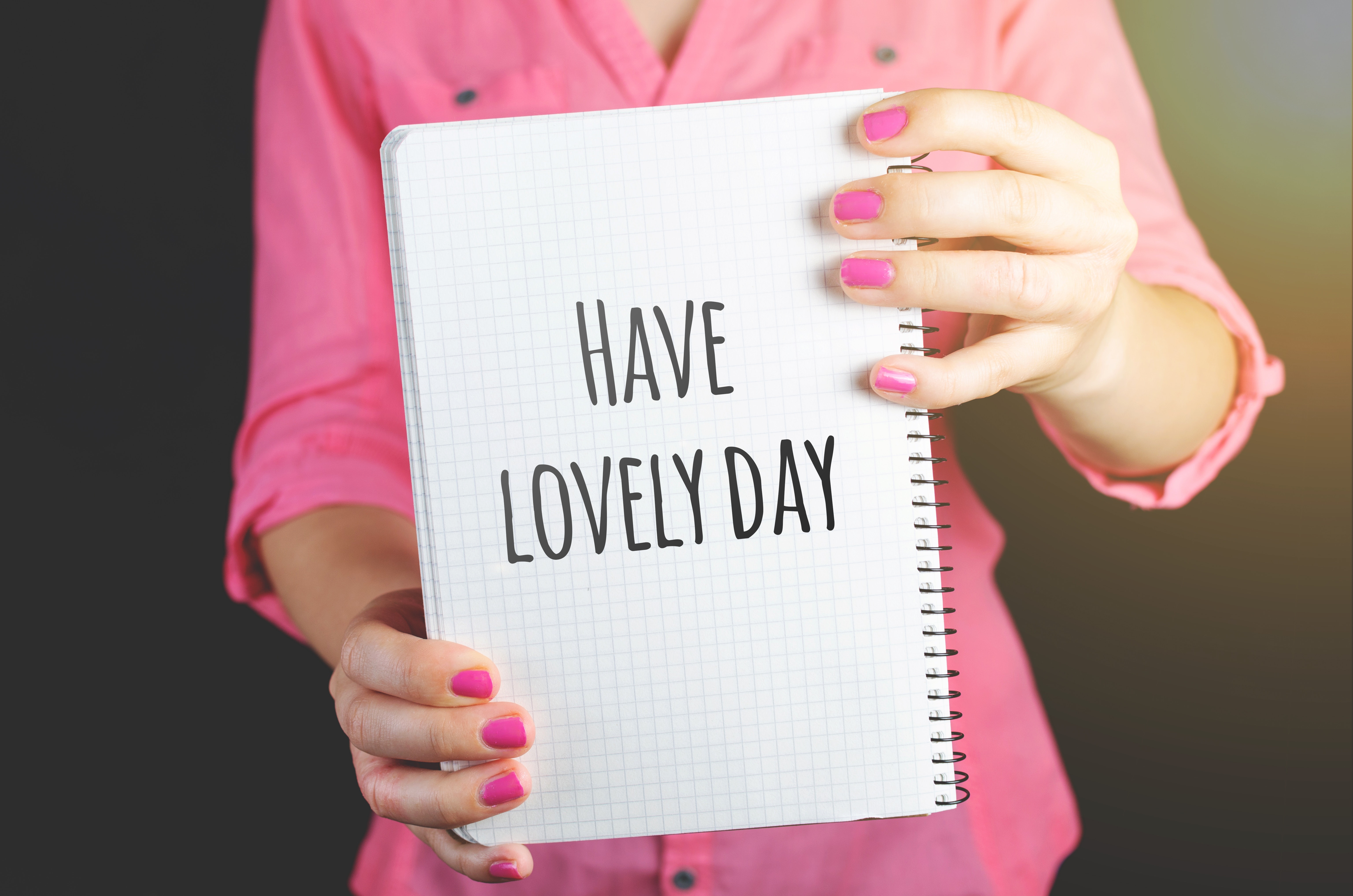 Woman Wearing Pink Dress Holding Graphing Notebook With Have a Lovely Day Sign, Ad, Notes, Woman, Text, HQ Photo