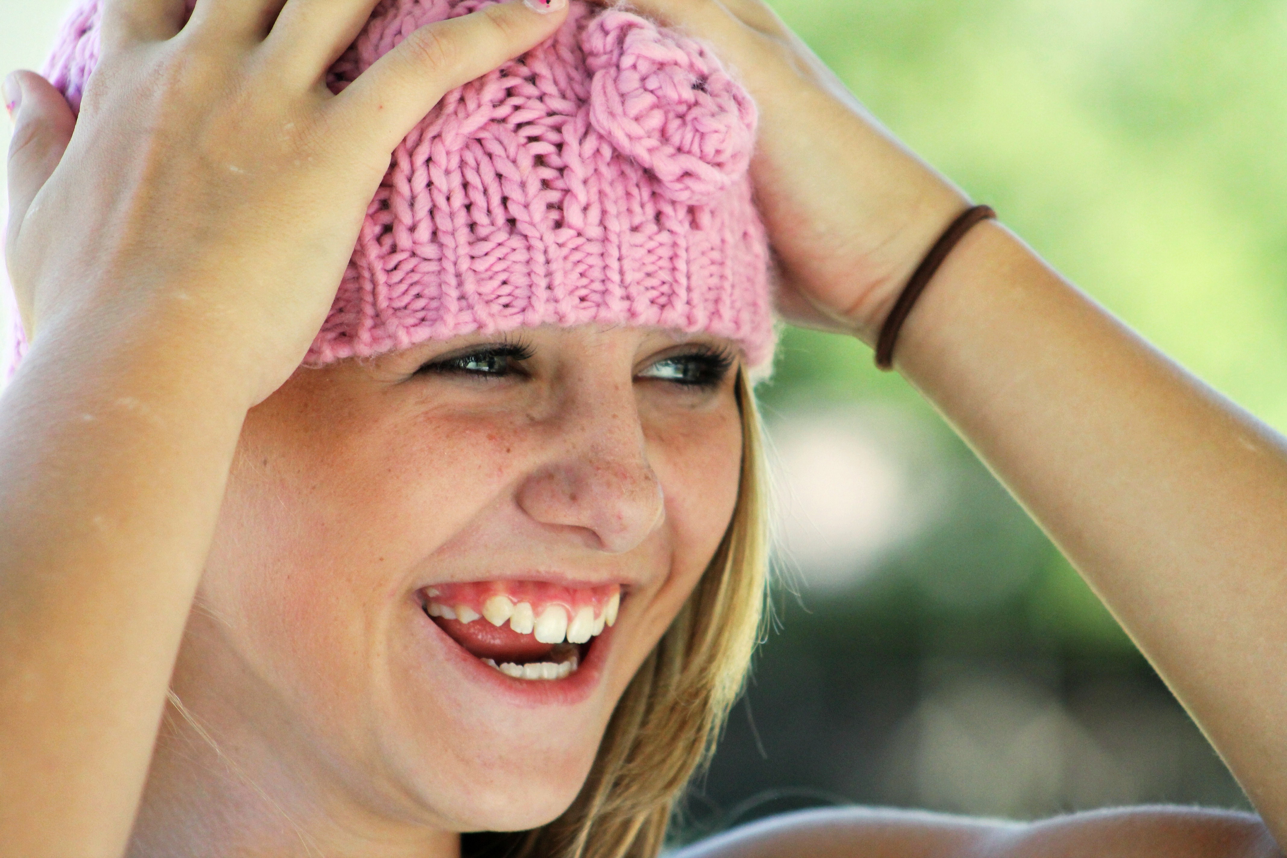 Woman wearing pink knit cap photo