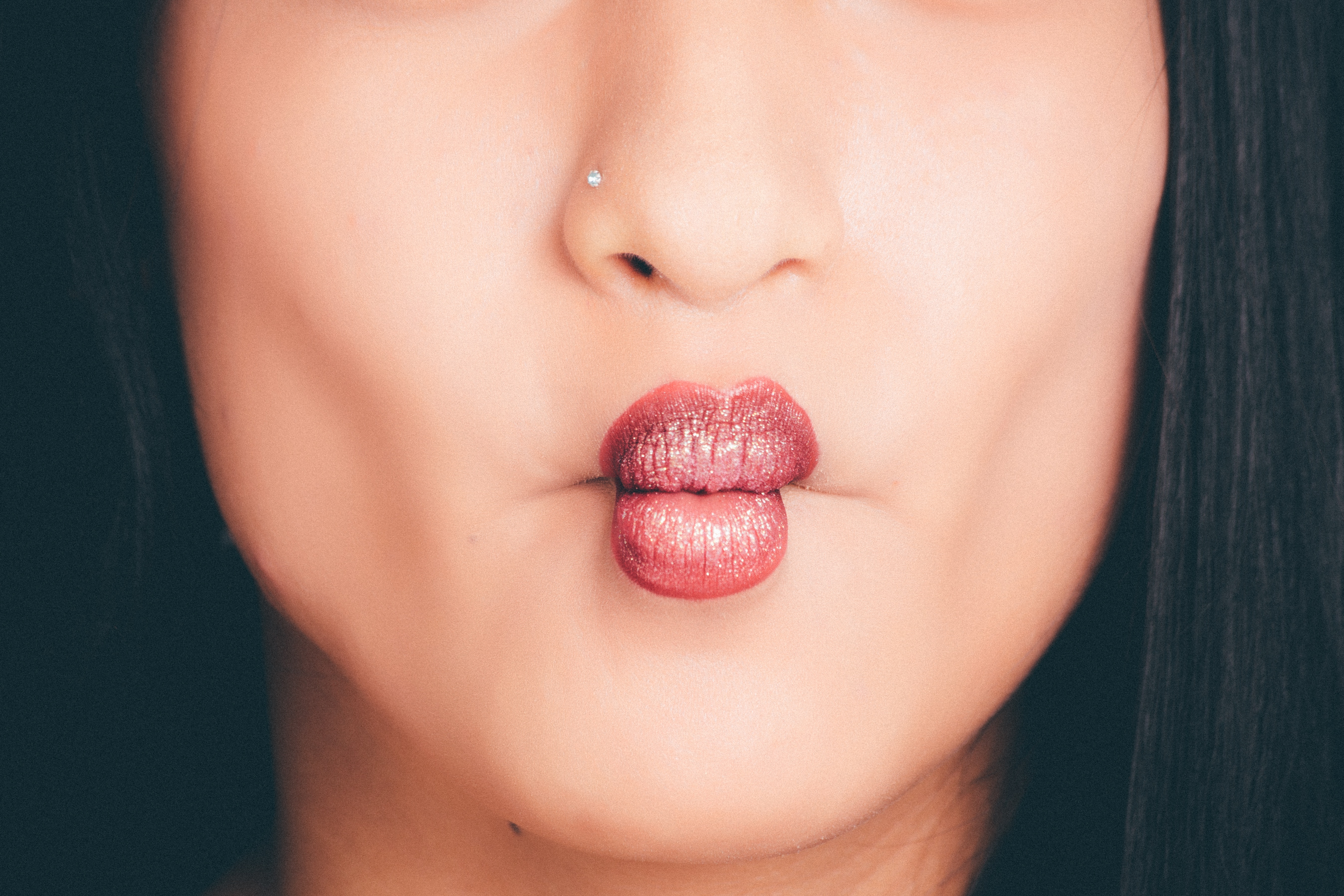 Woman wearing red lipgloss photo