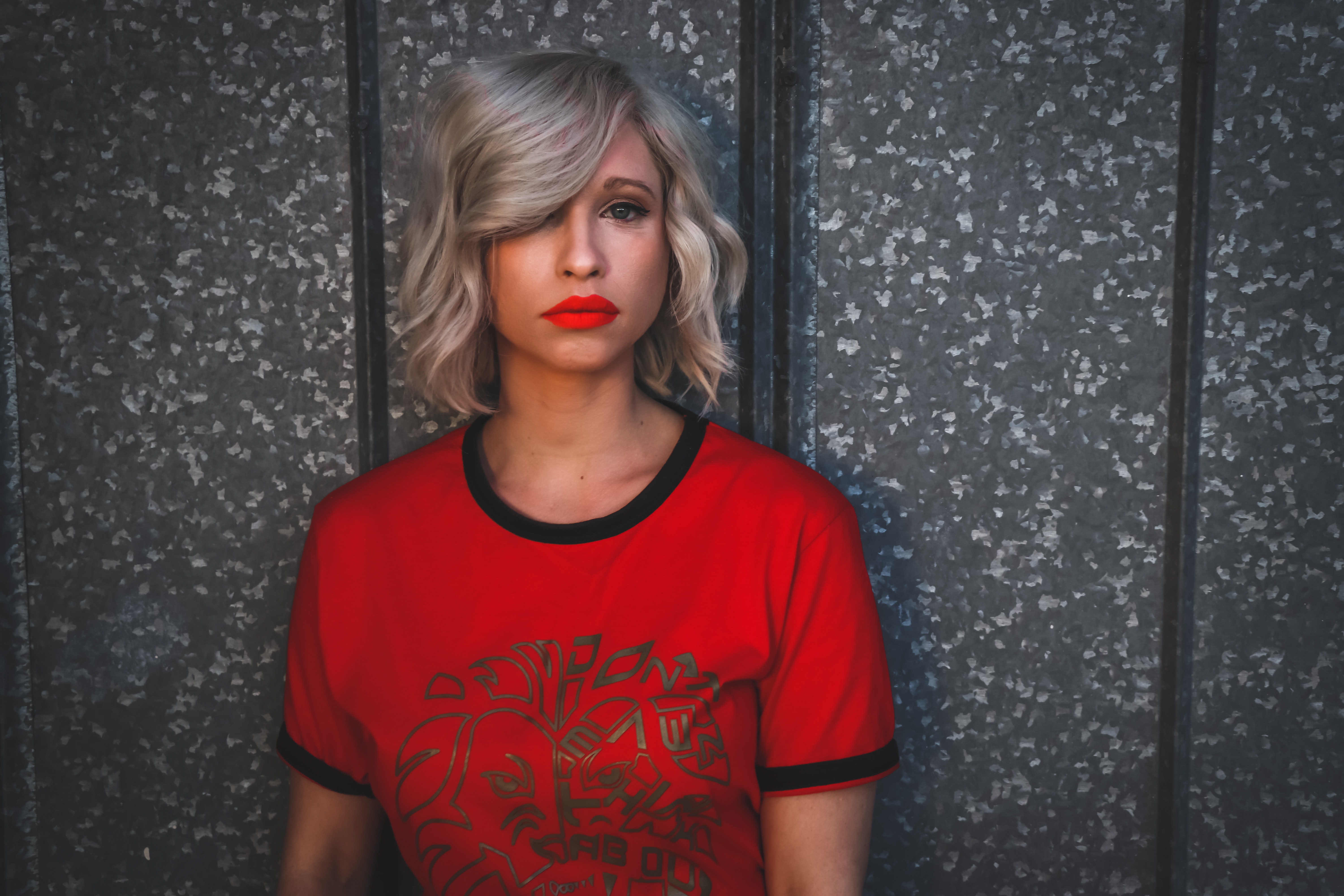 Woman wearing red shirt with red lipstick photo