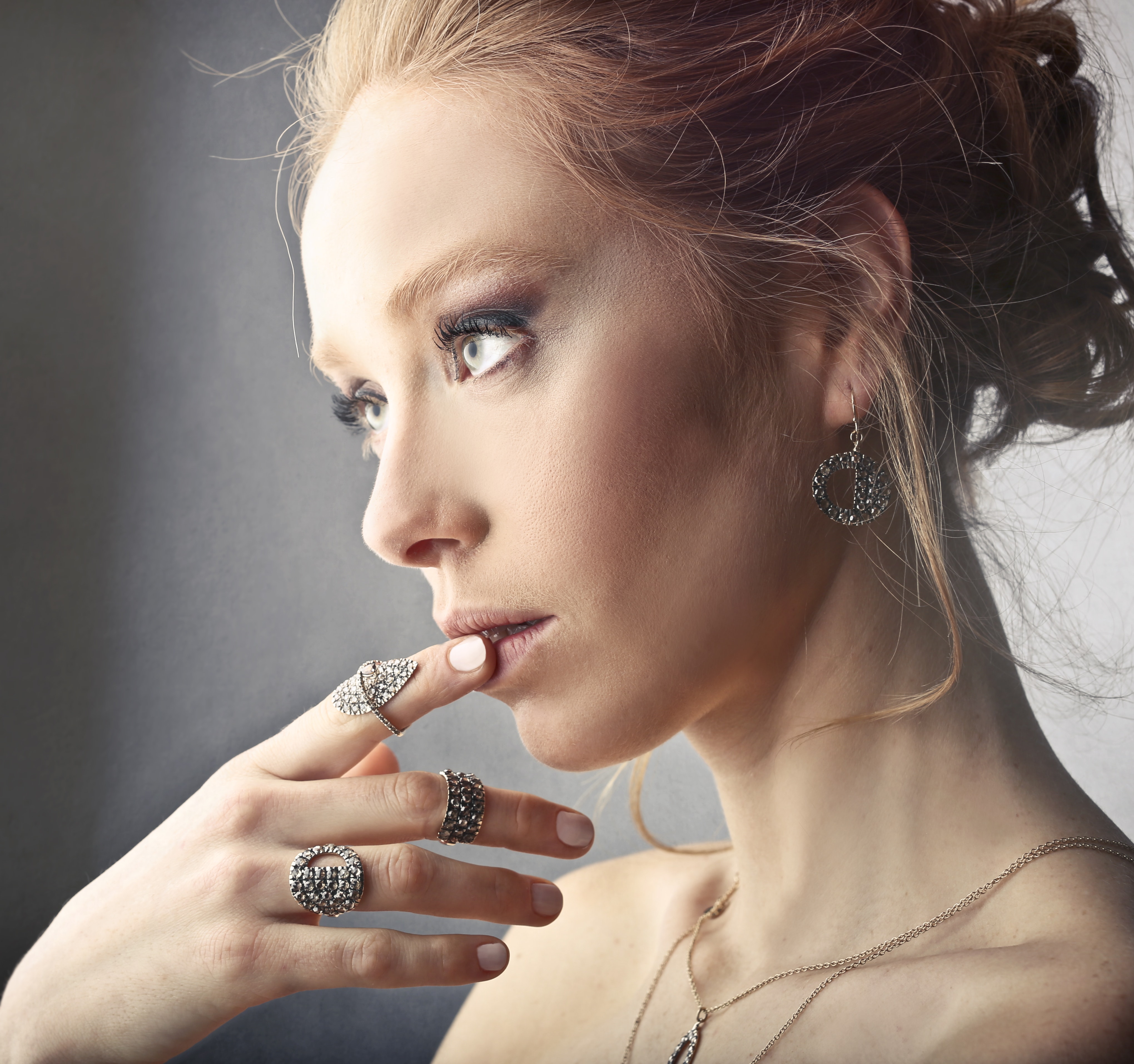 Woman wearing rings and earrings photo