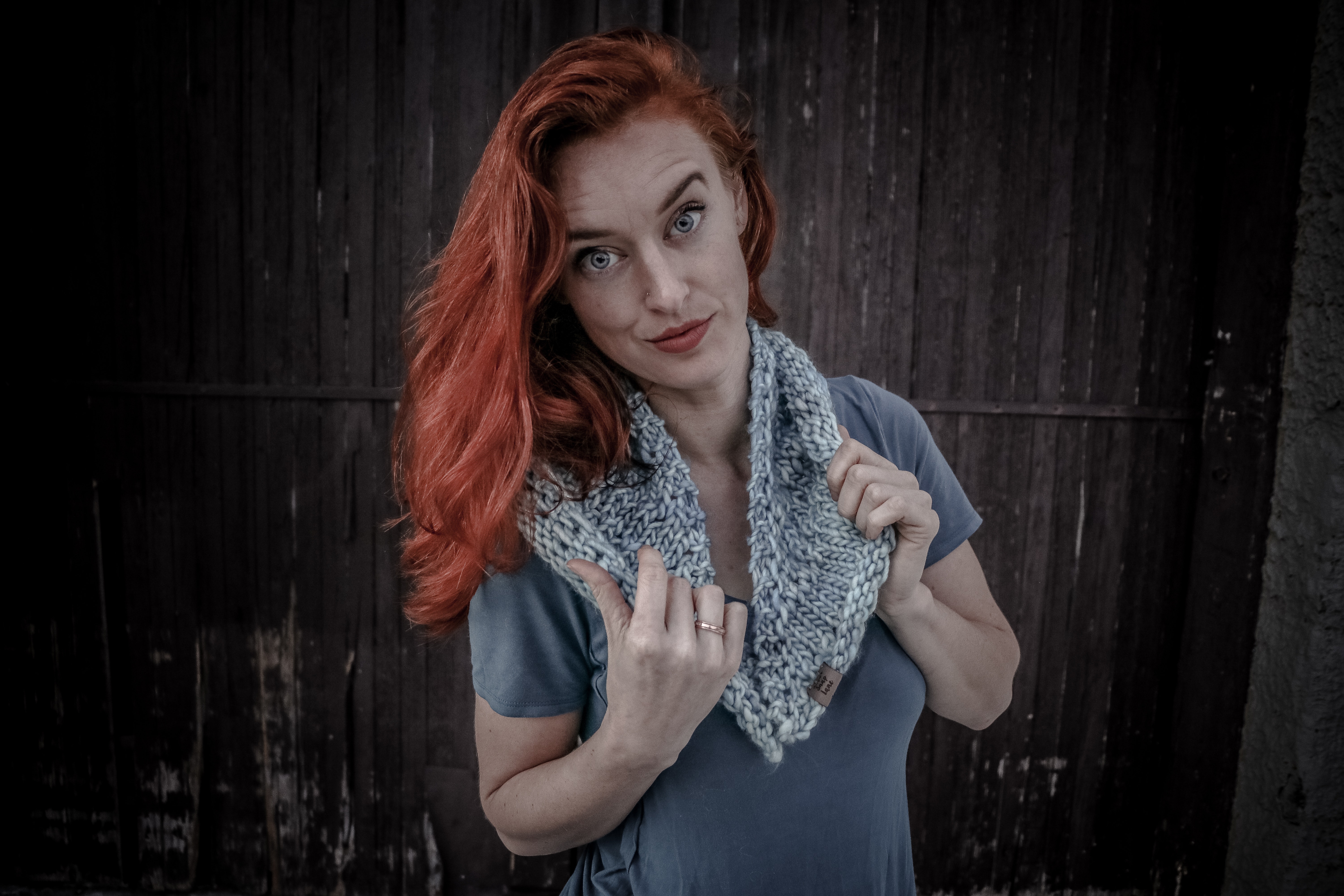 Woman wearing white and gray scarf photo