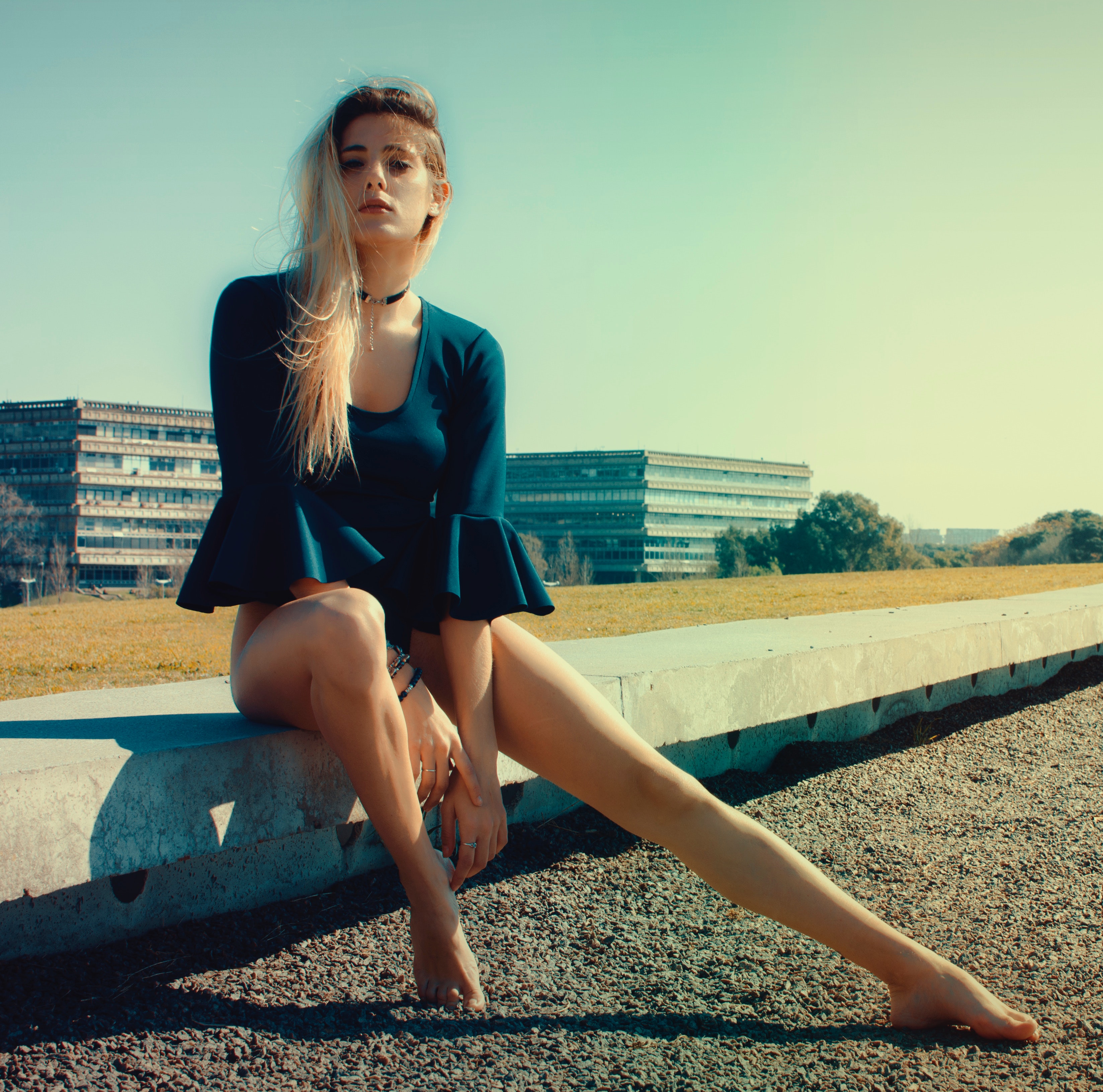 Woman Wears Black Scoop-neck Long-sleeved Blouse Seats on Grey Concrete Pavement, Barefoot, Model, Woman, Urban, HQ Photo