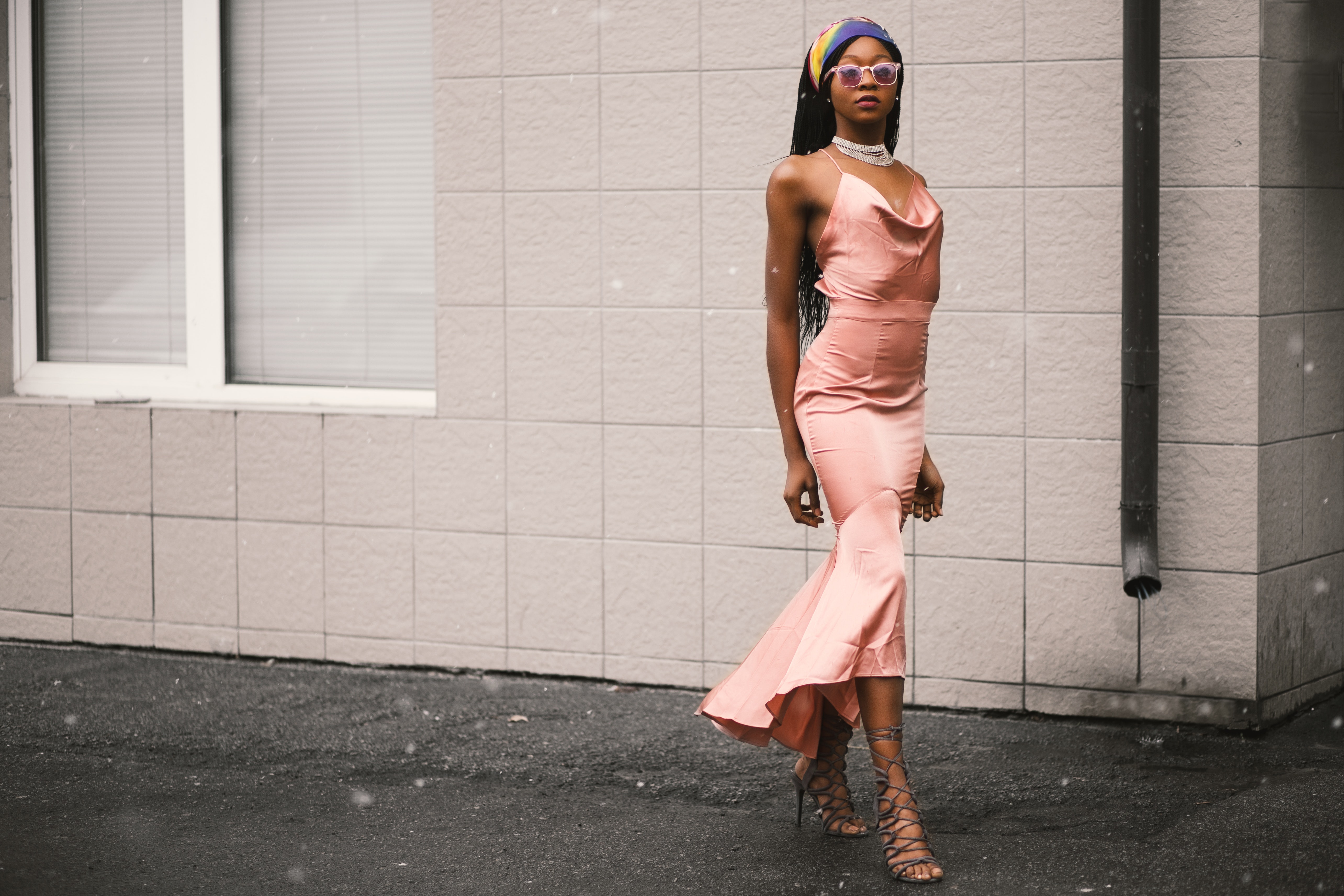 Woman wears pink spaghetti-strap dress photo