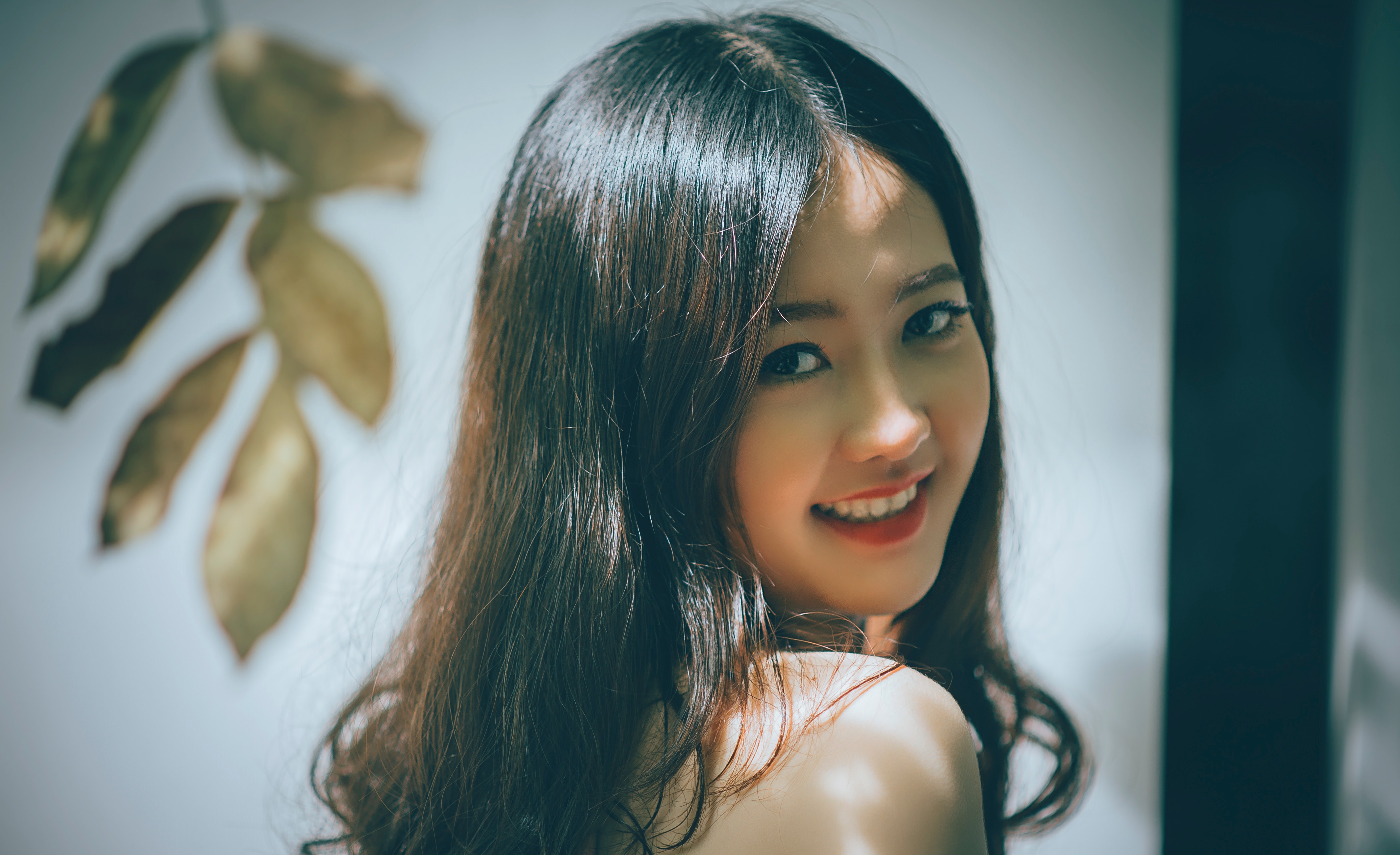 Woman with black long hair smiling photo