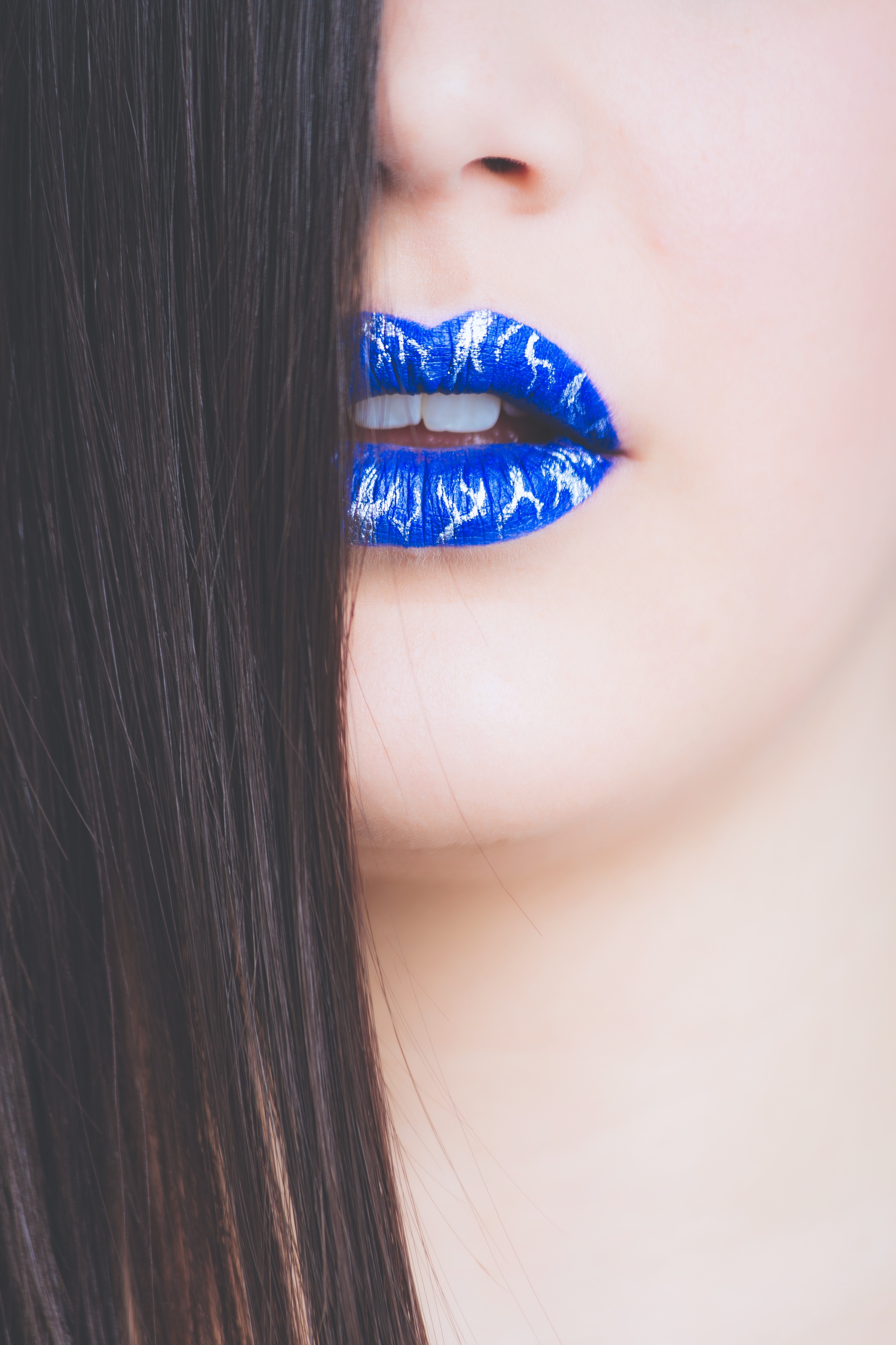 Woman with blue and gray lipstick photo