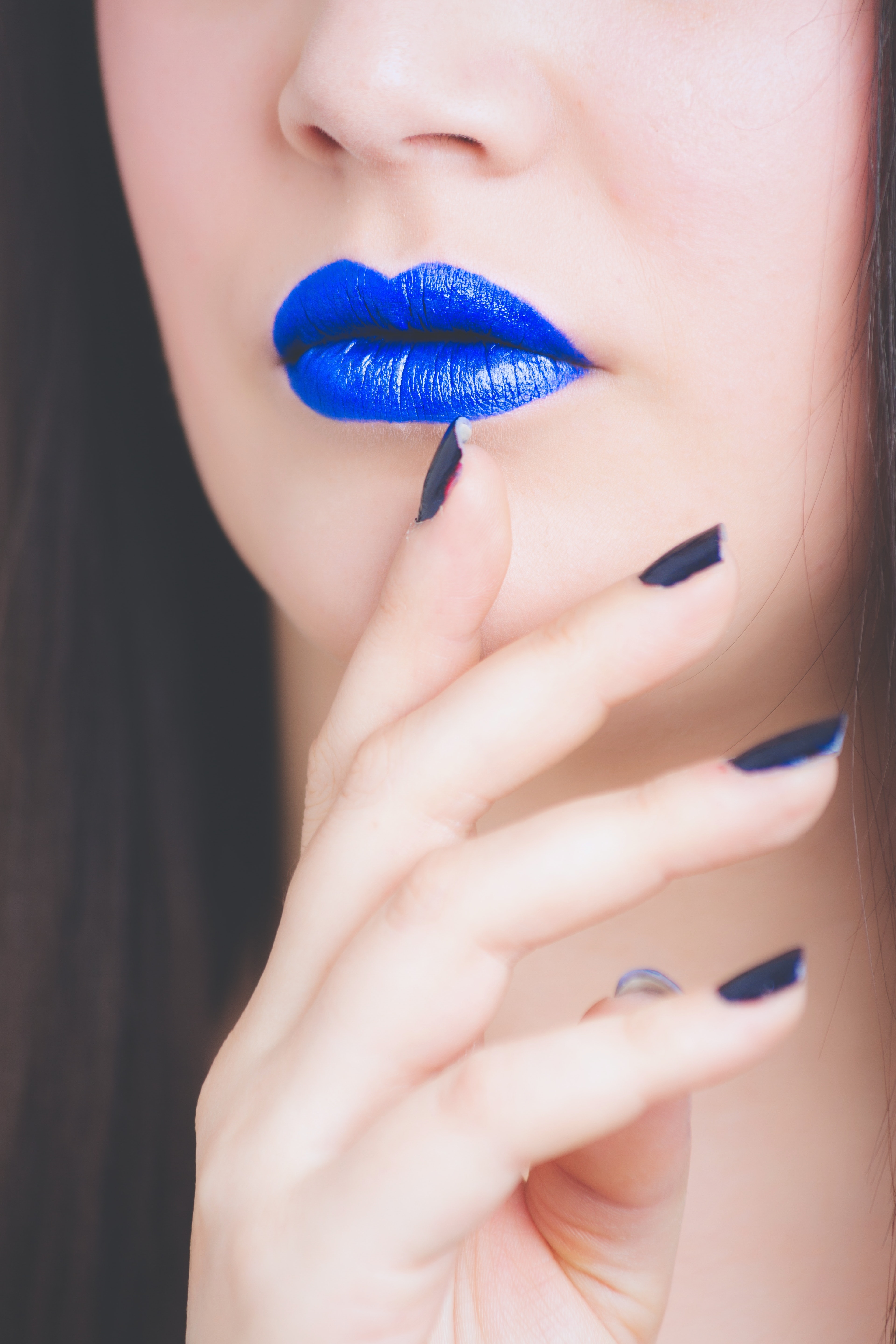 Woman with blue lipstick photo