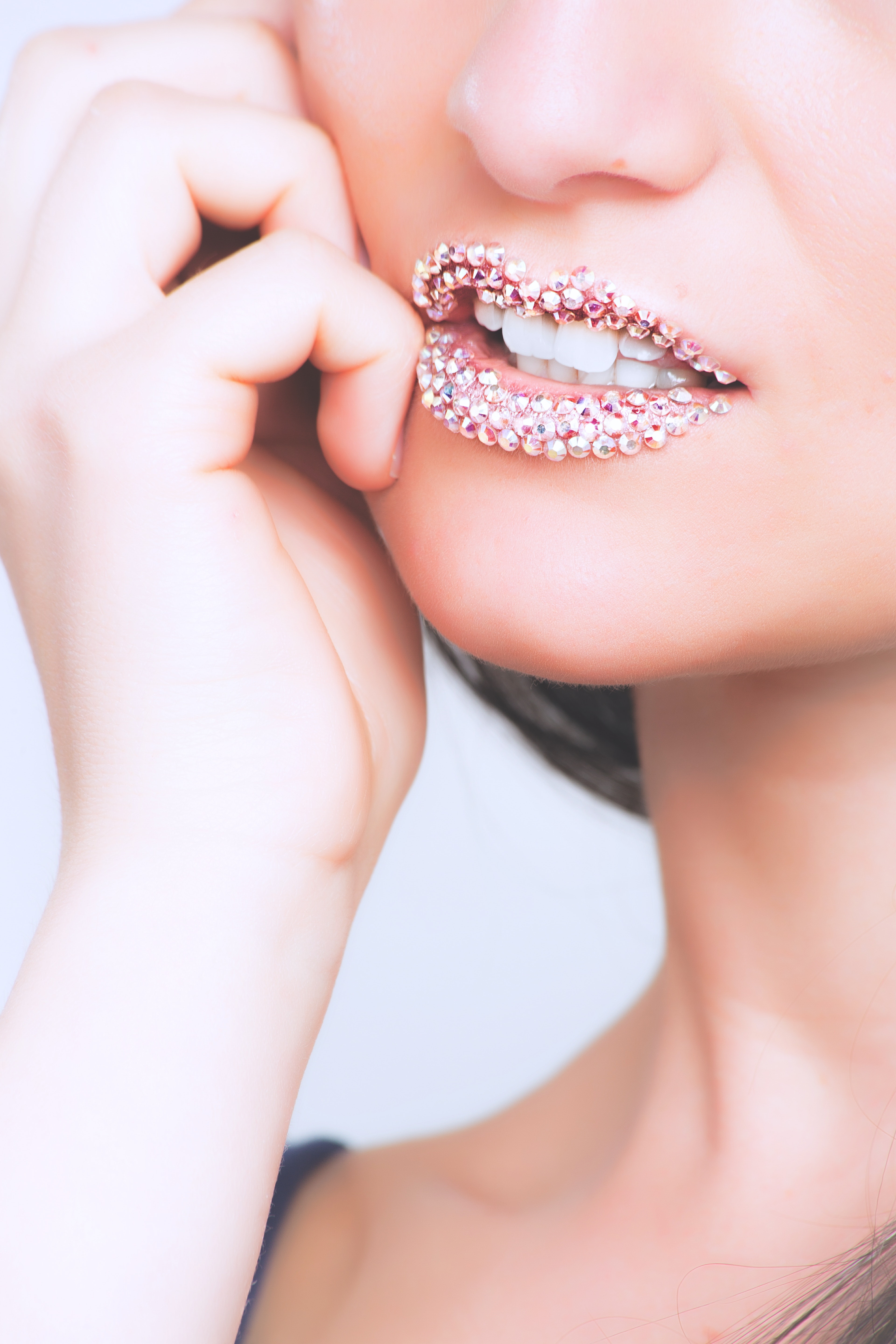 Woman with earrings on lips photo
