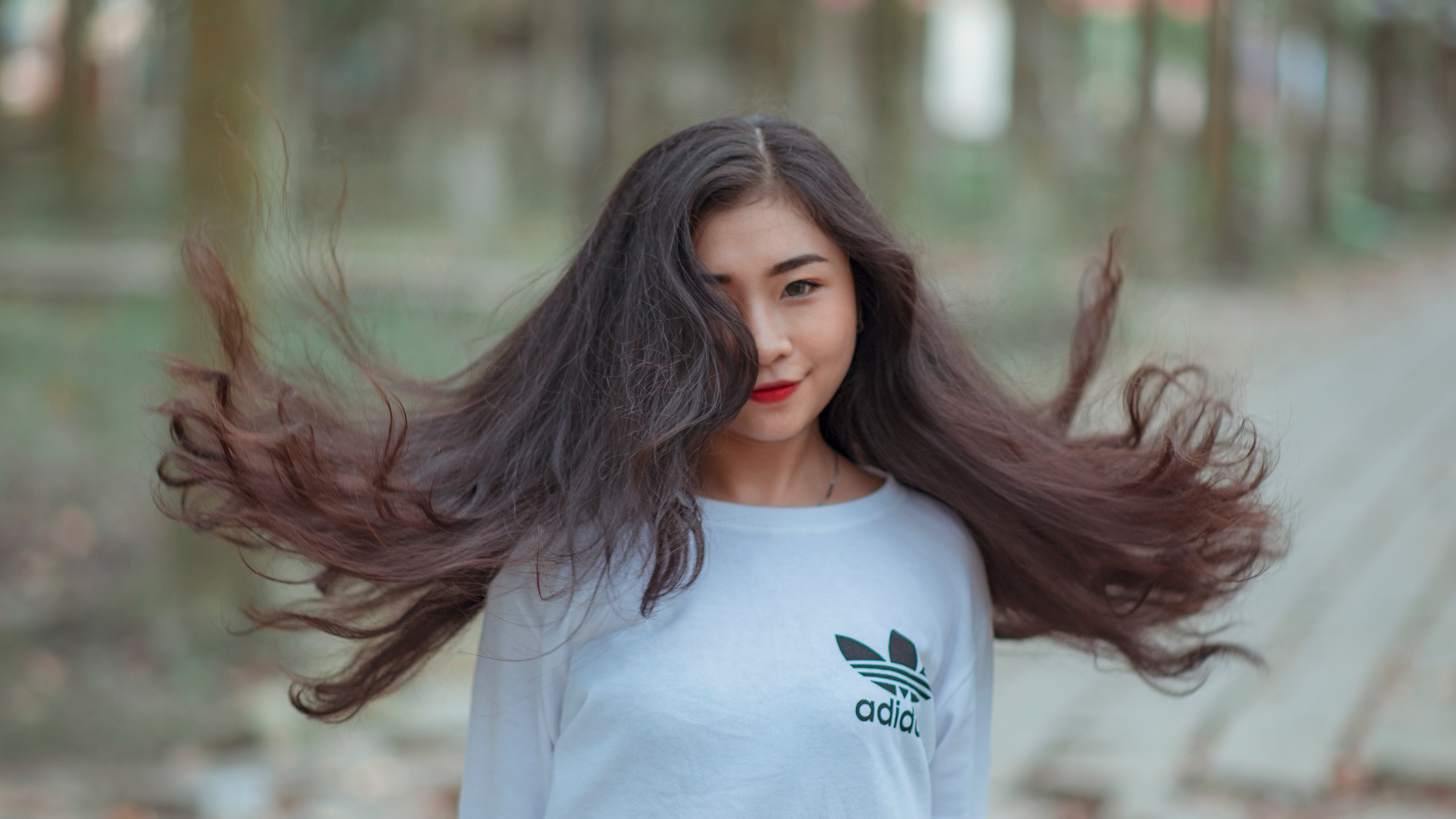 Free photo: Woman With Long Hair Waving on Air and Wearing White Adidas ...