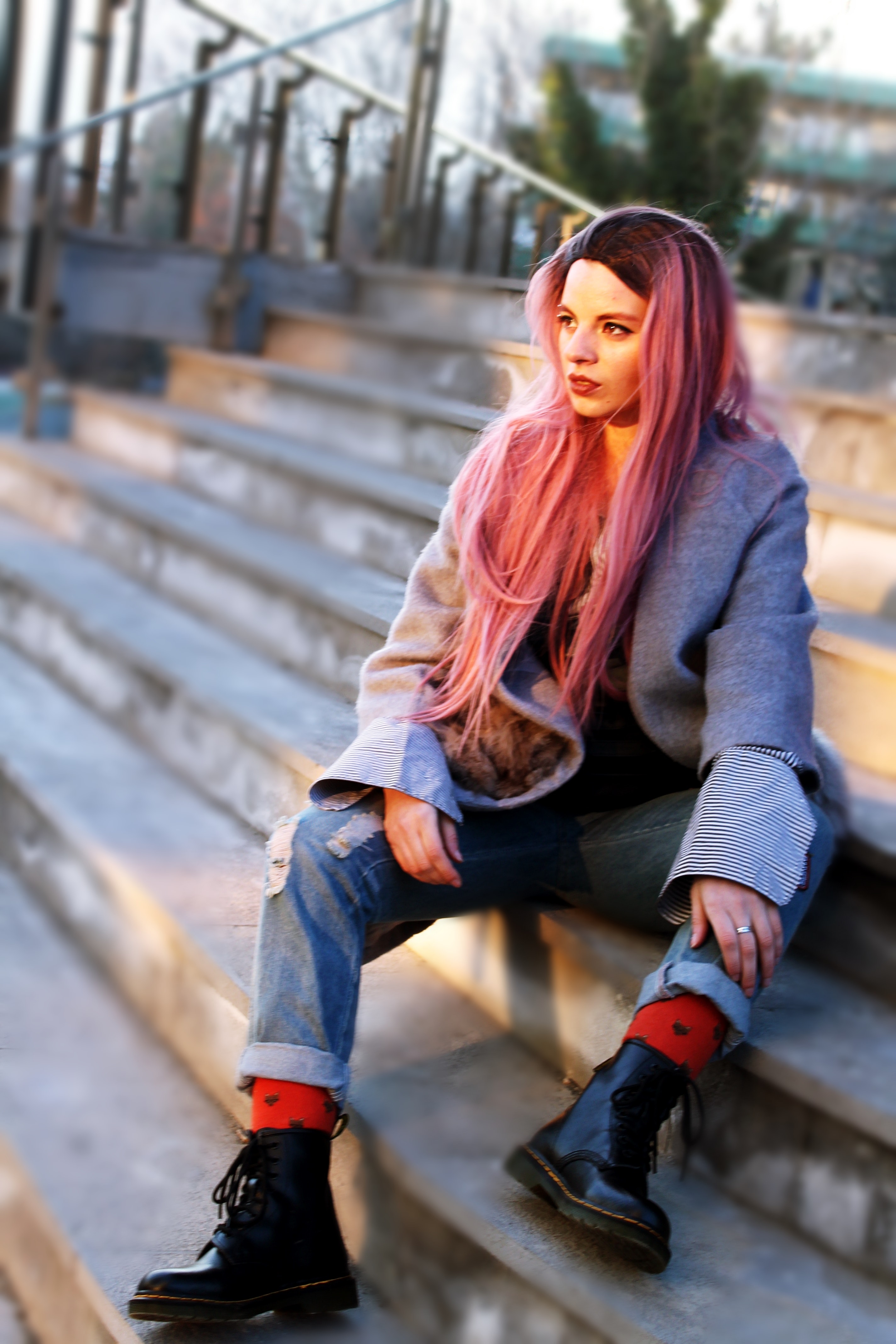Woman with pink long hair sitting photo