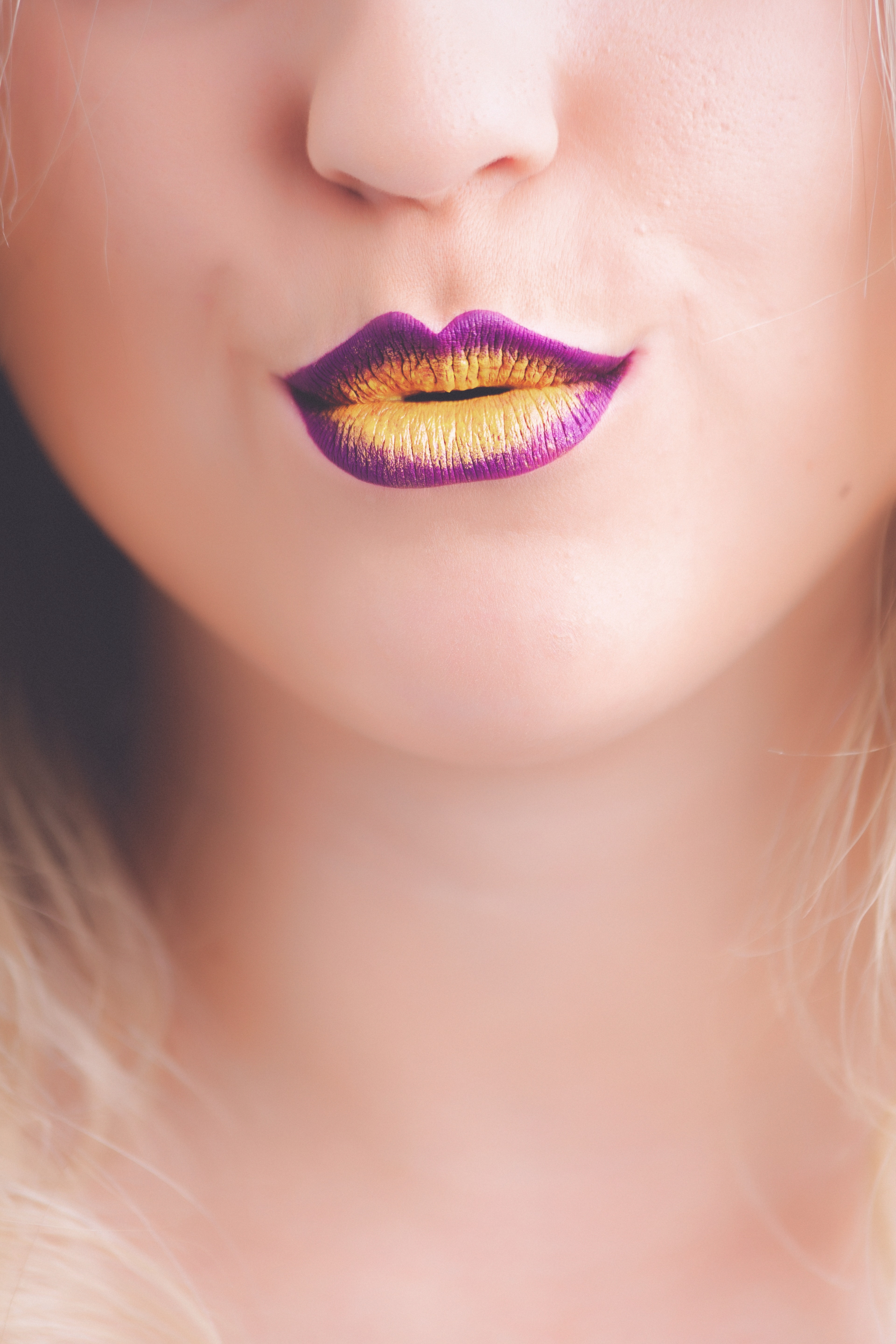 Woman with purple and yellow lipstick photo