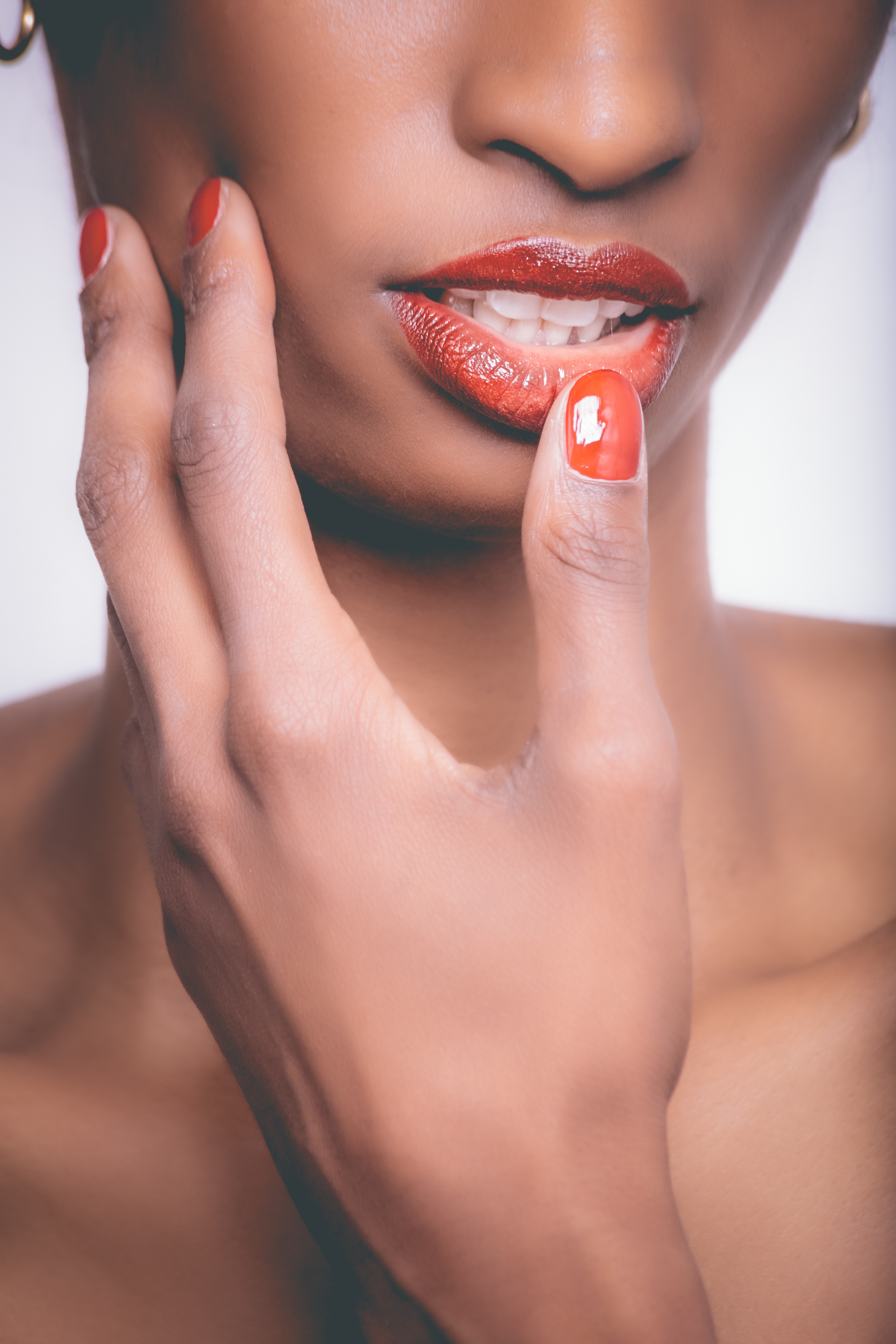 Woman with red lipstick and red manicure photo