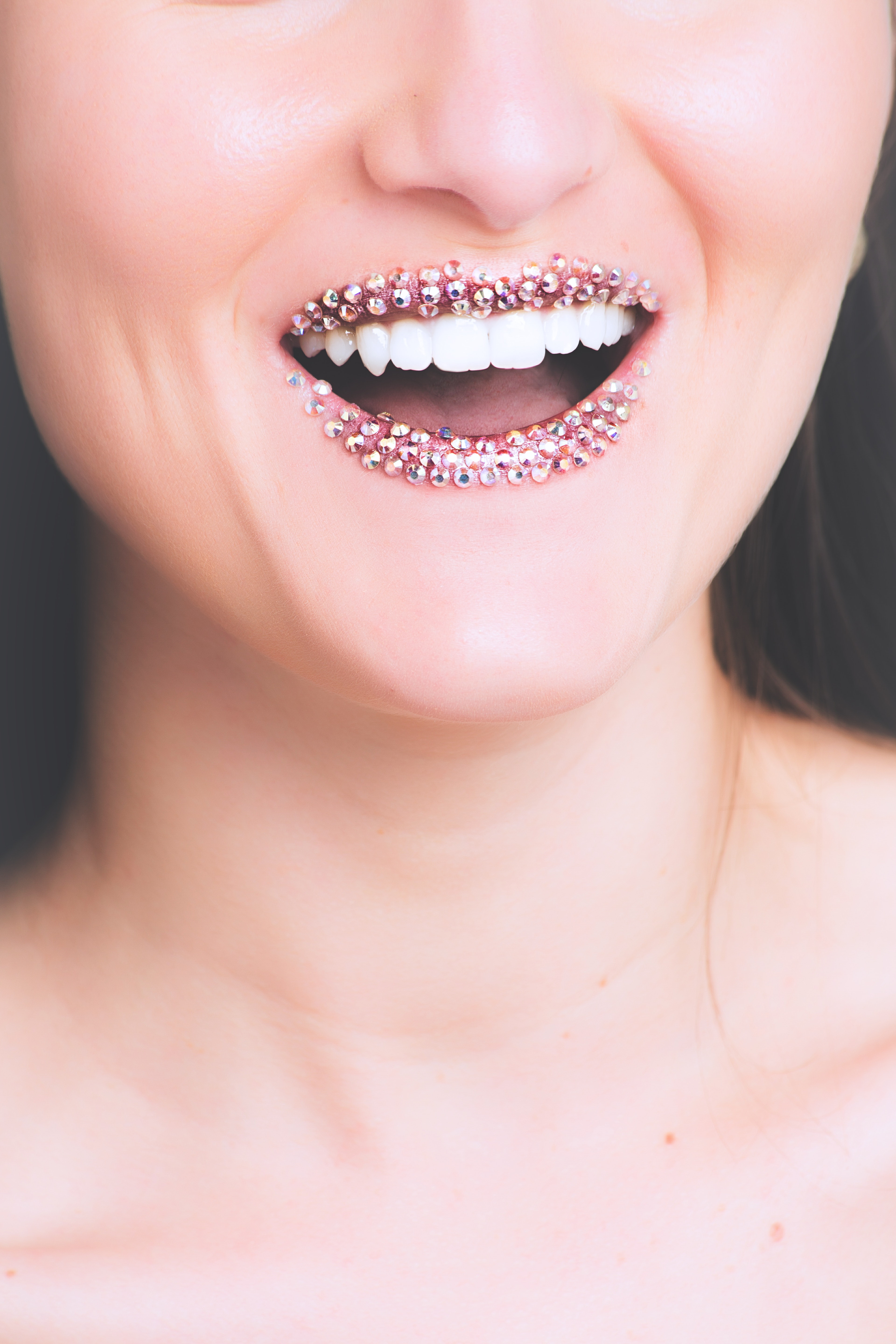 Woman with studded lips photo