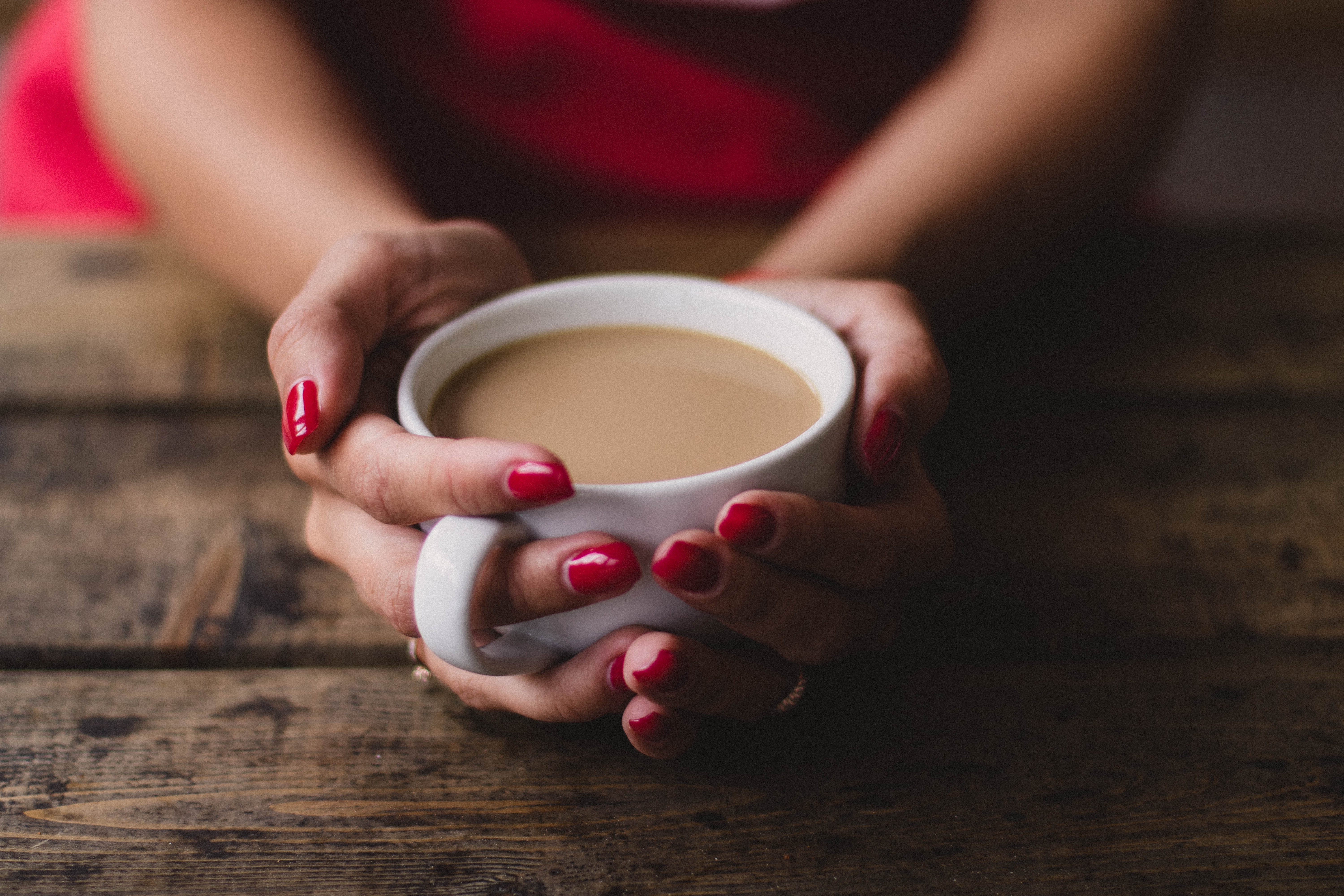 Women holding cup of coffee photo