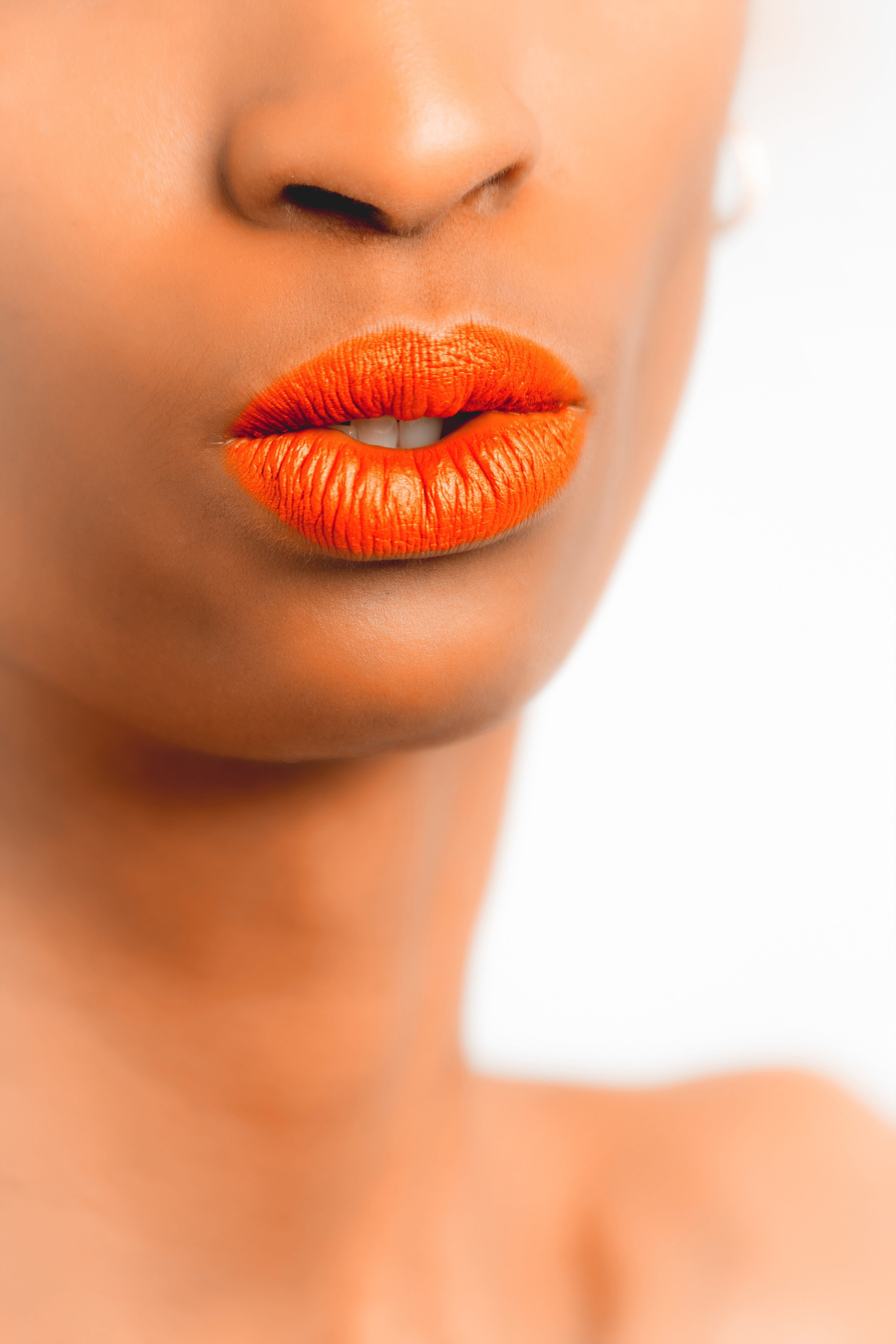 Women's orange lipstick photo