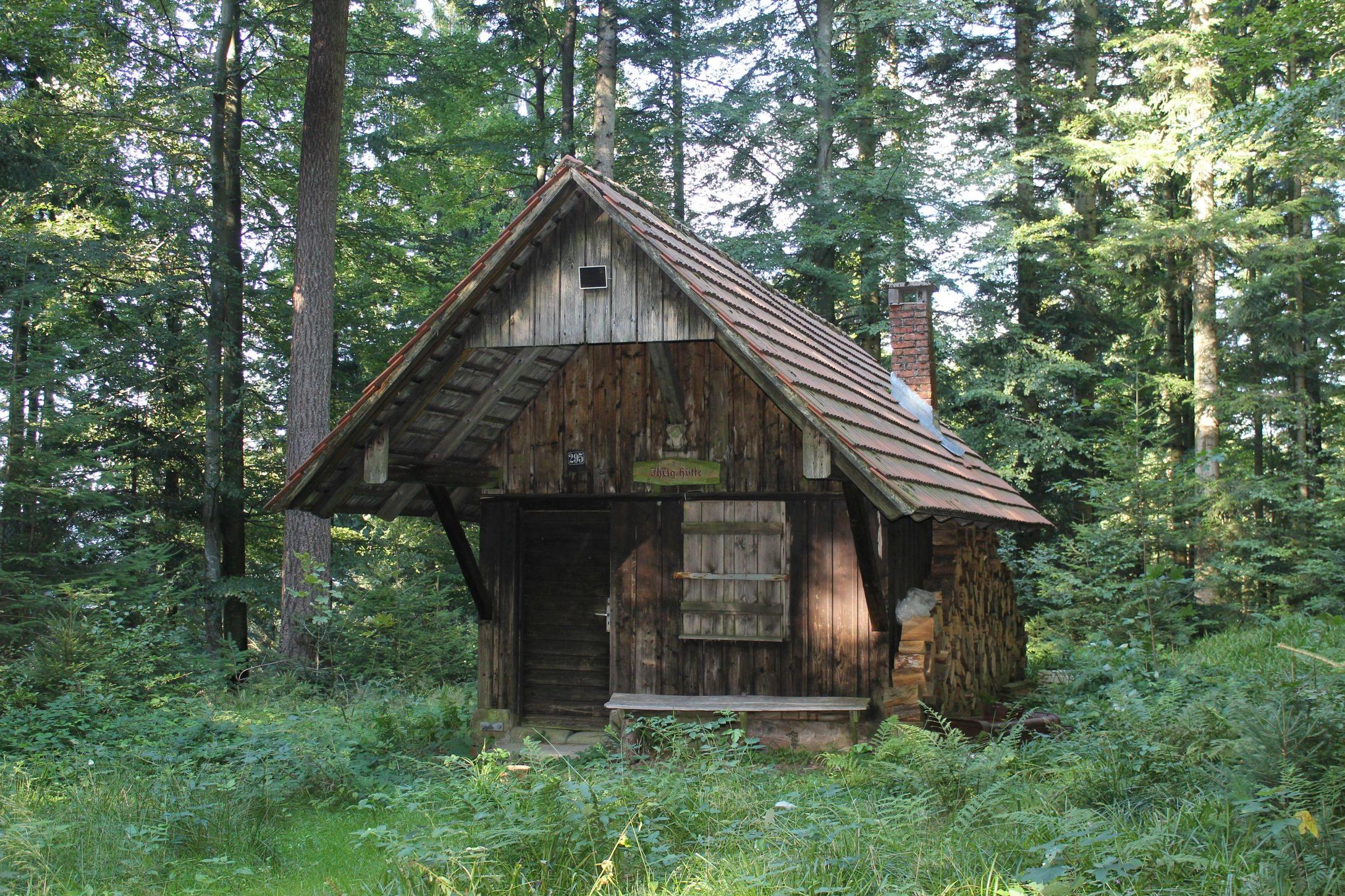 Little wooden cabin surrounded by trees in the Blackforest, Germany ...