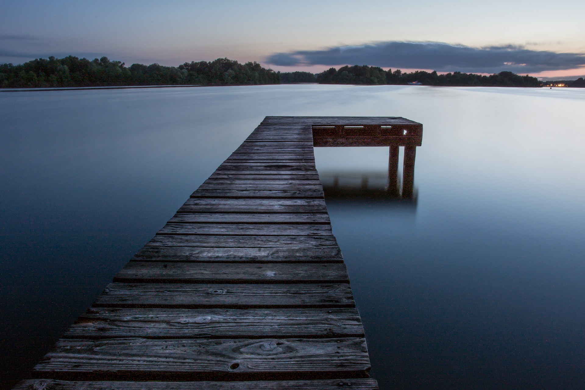 Wooden pier on the river photo