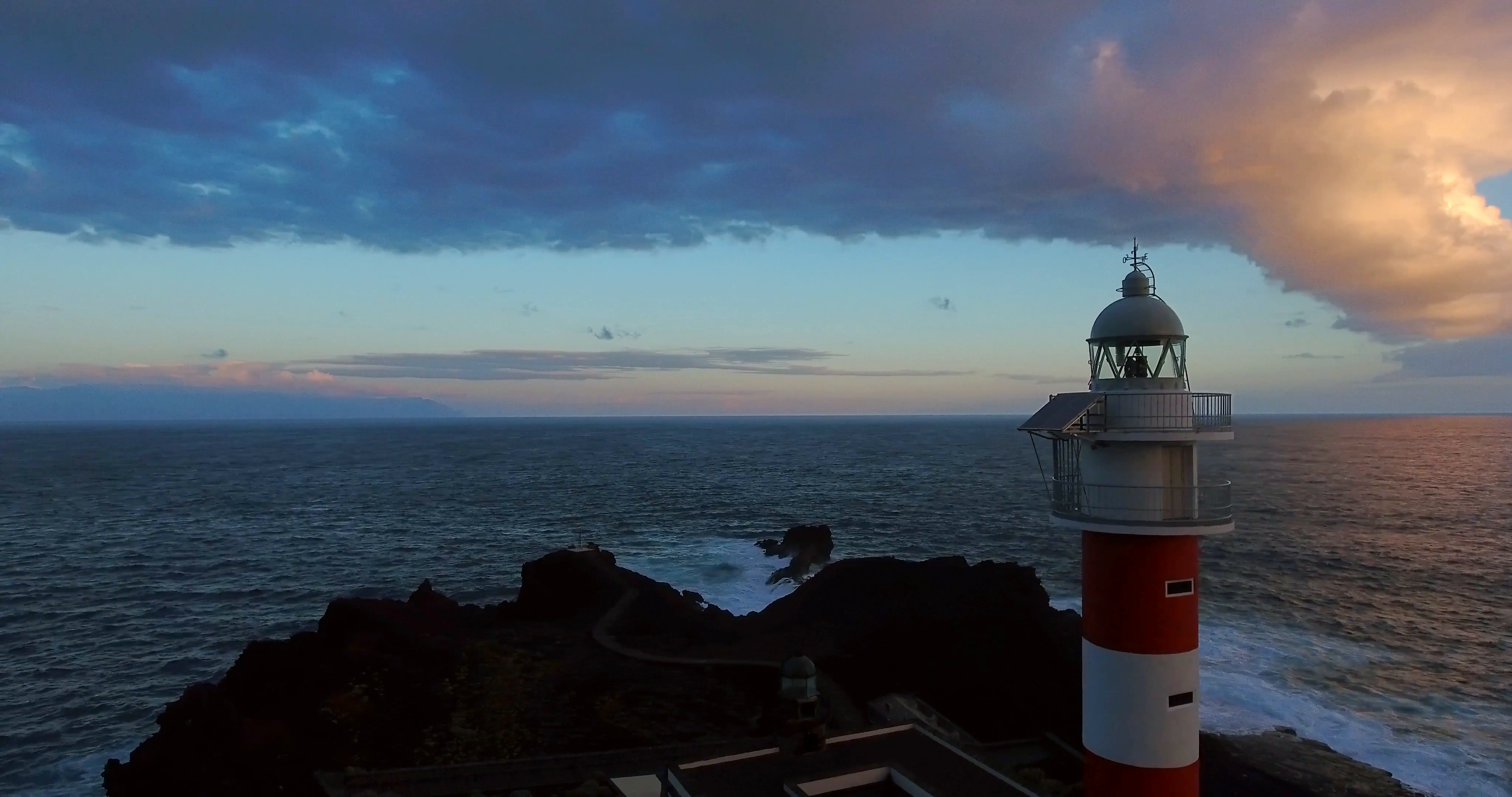 AERIAL: lighthouse against ocean at the sunset. Stock Video Footage ...